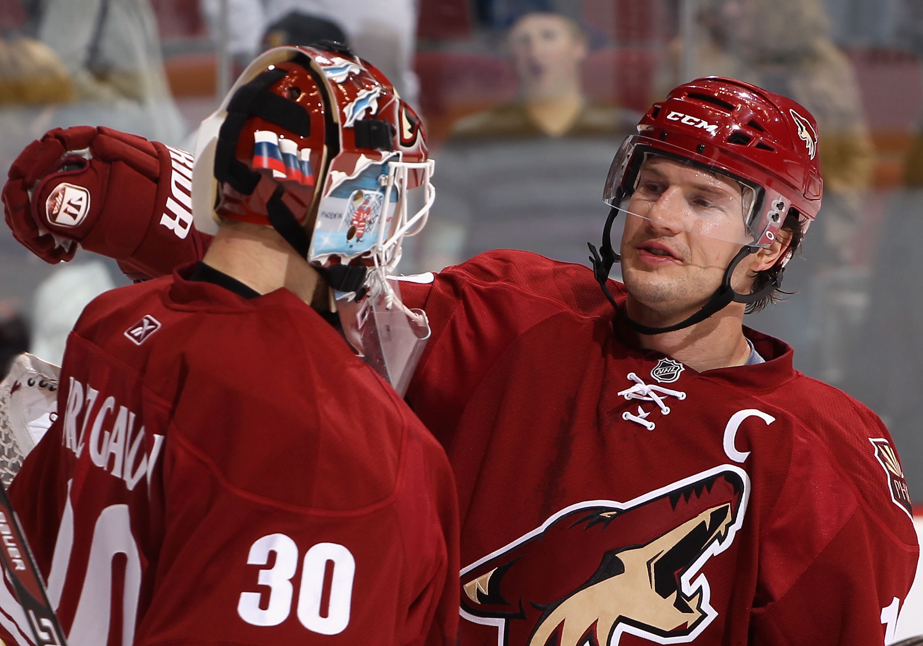 GLENDALE, AZ - JANUARY 15:  Shane Doan #19 of the Phoenix Coyotes congratulates goaltender Ilya Bryzgalov #30 after defeating the Anaheim Ducks in the NHL game at Jobing.com Arena on January 15, 2011 in Glendale, Arizona.  The Coyotes defeated the Ducks 6