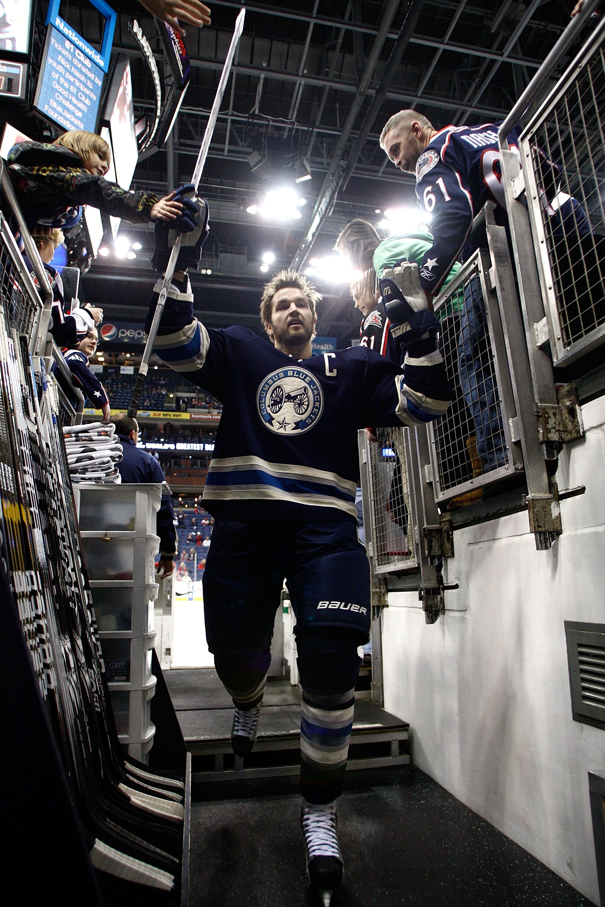 COLUMBUS, OH - JANUARY 14:  Rick Nash #61 of the Columbus Blue Jackets high fives fans after warming up prior to the start of the game against the Detroit Red Wings on January 14, 2011 at Nationwide Arena in Columbus, Ohio. (Photo by John Grieshop/Getty I