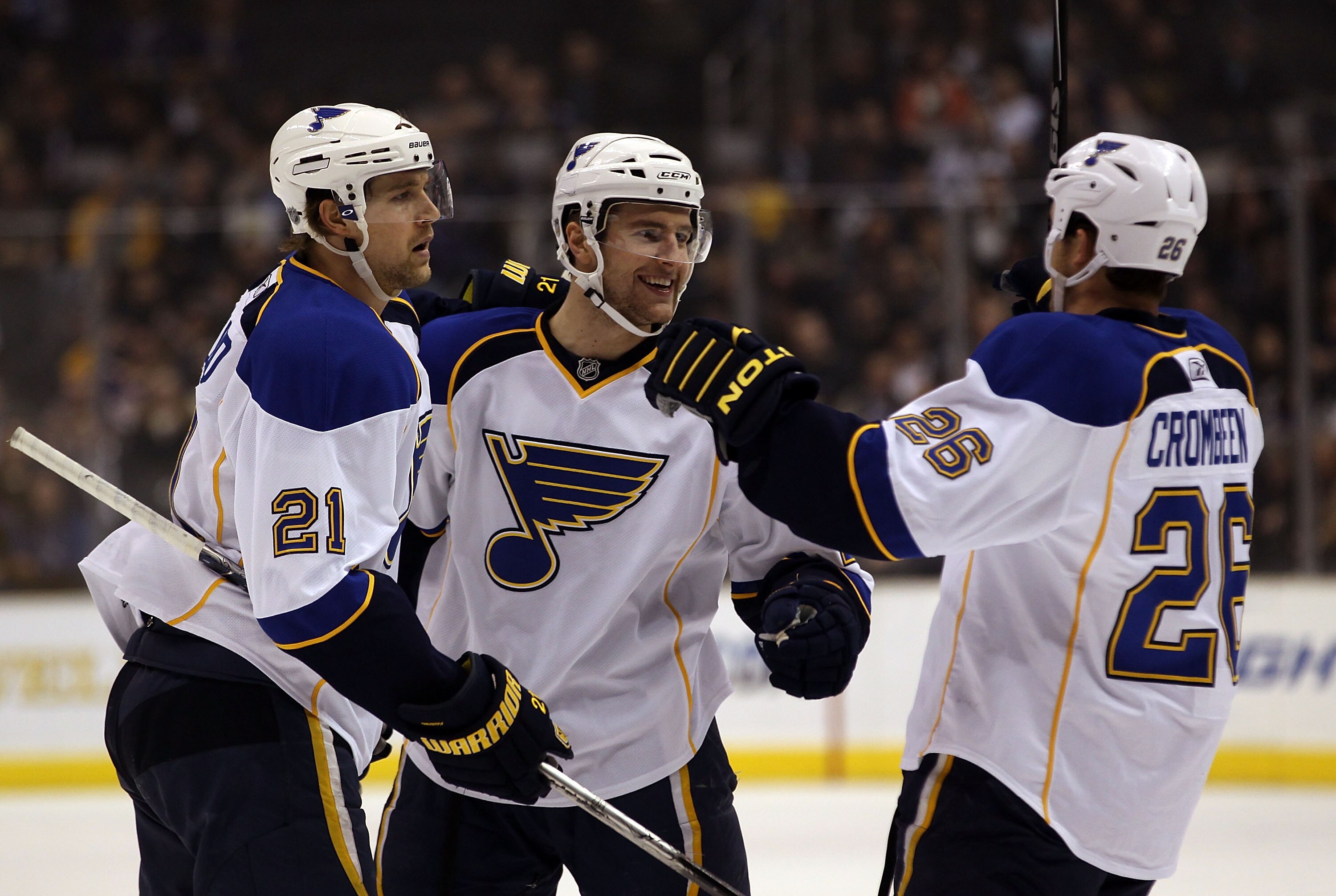 LOS ANGELES, CA - JANUARY 13: B.J. Crombeen #26 (R) of the St. Louis Blues scores at 11:38 of the first period against the Los Angeles Kings and is joined by Patrik Berglund #21 (L) and Alex Pietrangelo #27 (C) at the Staples Center on January 13, 2011 in