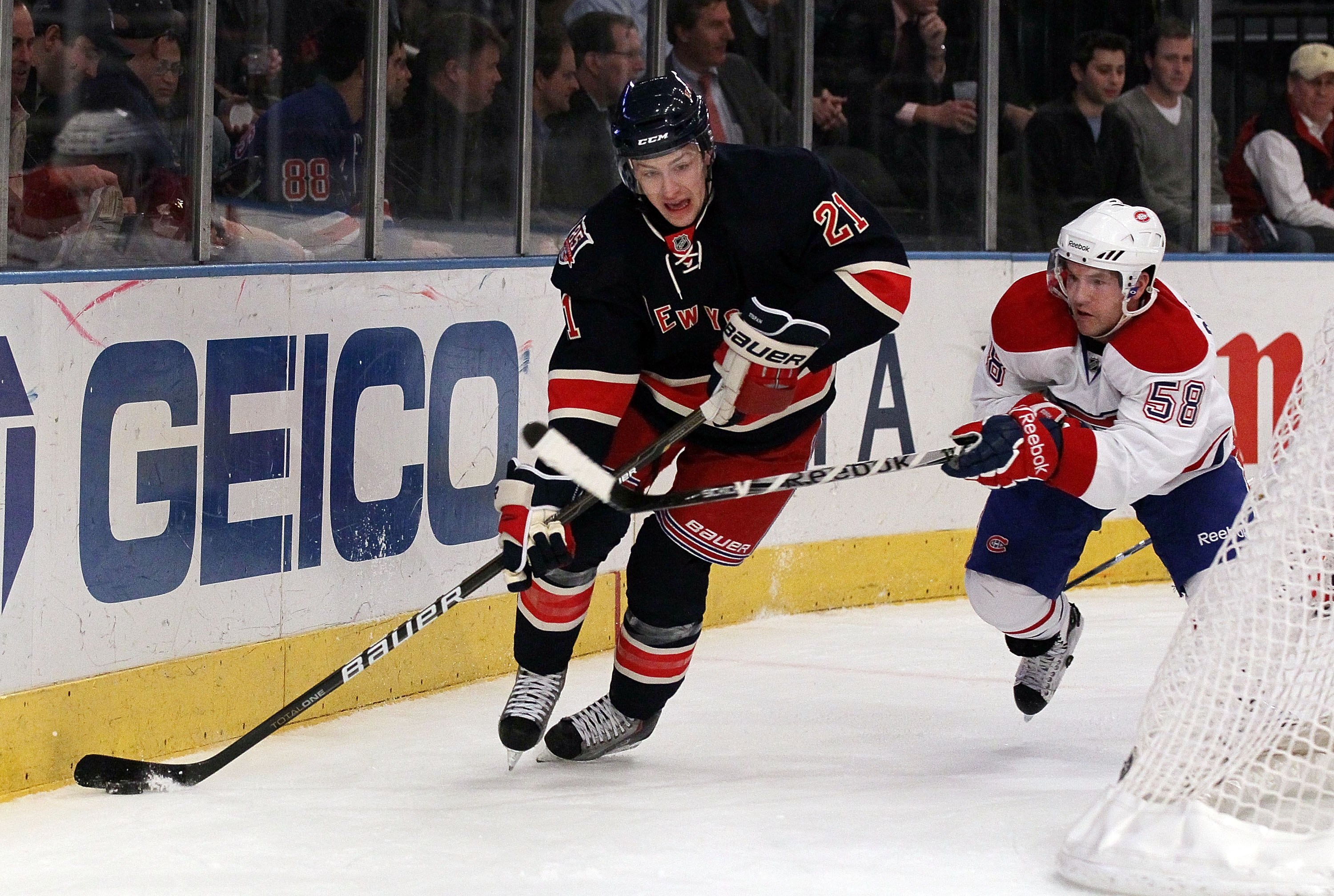 NEW YORK, NY - JANUARY 11:  Derek Stepan #21 of the New York Rangers skates against David Desharnais #58 of the Montreal Canadiens on January 11, 2011 at Madison Square Garden in New York City. Montreal defeated the Rangers 2-1.  (Photo by Jim McIsaac/Get