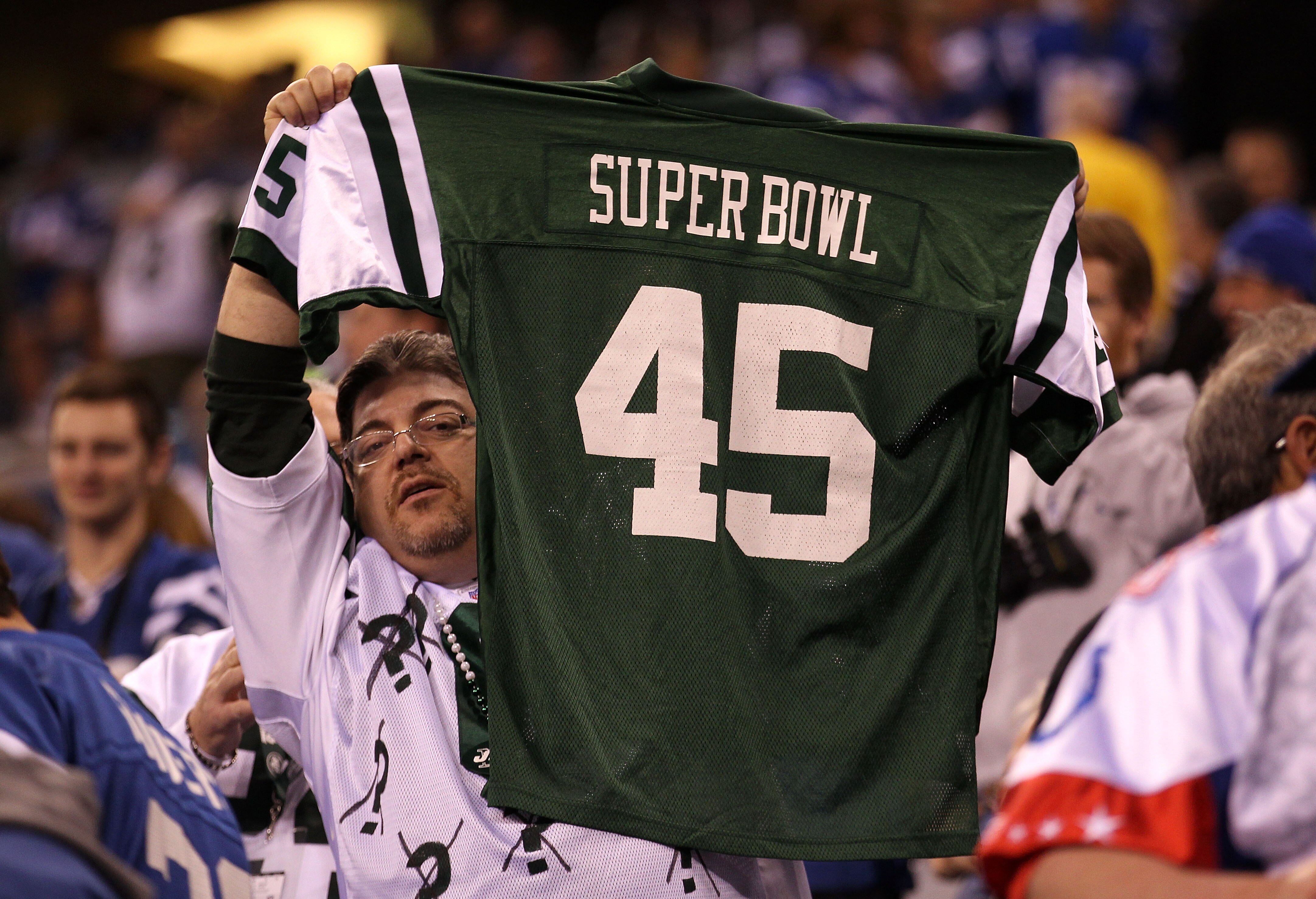 INDIANAPOLIS, IN - JANUARY 08:  A fan of the New York Jets holds up a Jets Jersey which reads 'Super Bowl 45' against the Indianapolis Colts during their 2011 AFC wild card playoff game at Lucas Oil Stadium on January 8, 2011 in Indianapolis, Indiana. The