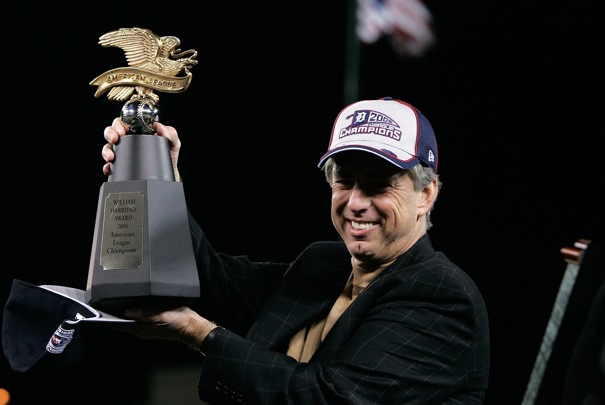 DETROIT - OCTOBER 14: General Manager Dave Dombrowski of the Detroit Tigers holds the AMerican Championship Trophy after the Tigers won 6-3 against the Oakland Athletics during Game Four of the American League Championship Series October 14, 2006 at Come DETROIT - OCTOBER 14: General Manager Dave Dombrowski of the Detroit Tigers holds the AMerican Championship Trophy after the Tigers won 6-3 against the Oakland Athletics during Game Four of the American League Championship Series October 14, 2006 at Come