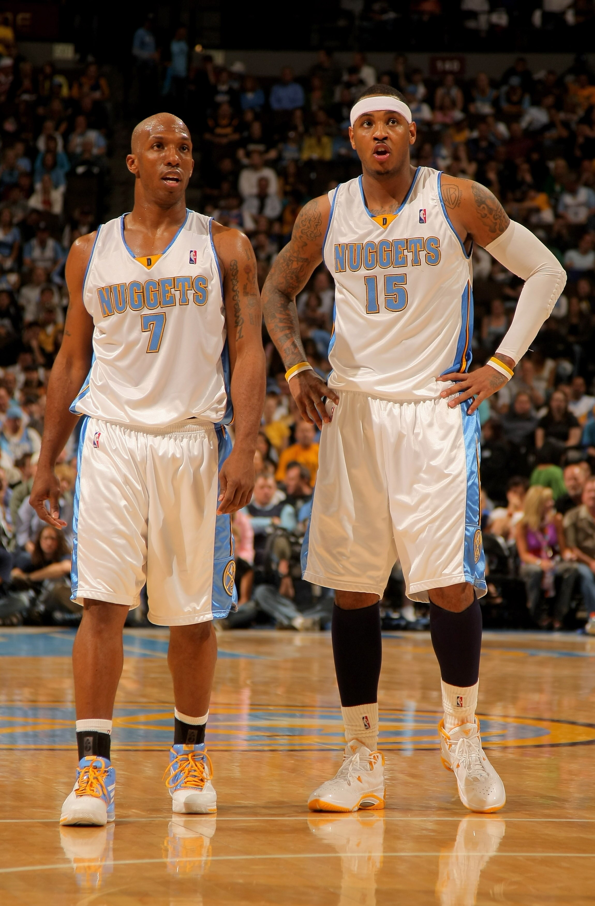 DENVER - APRIL 29:  Chauncey Billups #7 and Carmelo Anthony #15 of the Denver Nuggets wait during  a free throw against the New Orleans Hornets in Game Five of the Western Conference Quarterfinals during the 2009 NBA Playoffs at Pepsi Center on April 29,