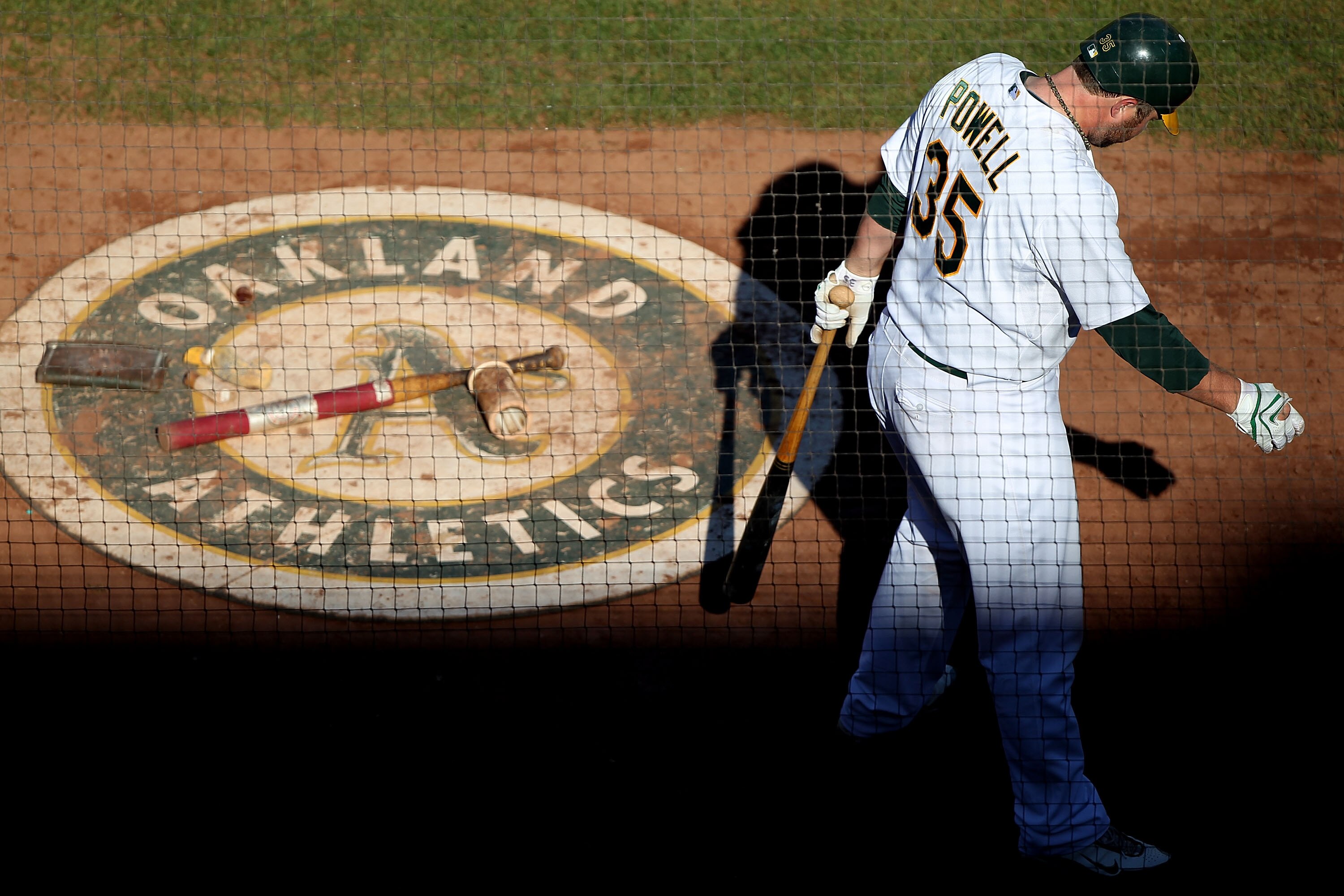 OAKLAND, CA - SEPTEMBER 26:  Landon Powell #35 of the Oakland Athletics waits to bat against the Texas Rangers during a Major League Baseball game at the Oakland-Alameda County Coliseum on September 26, 2010 in Oakland, California. (Photo by Jed Jacobsohn