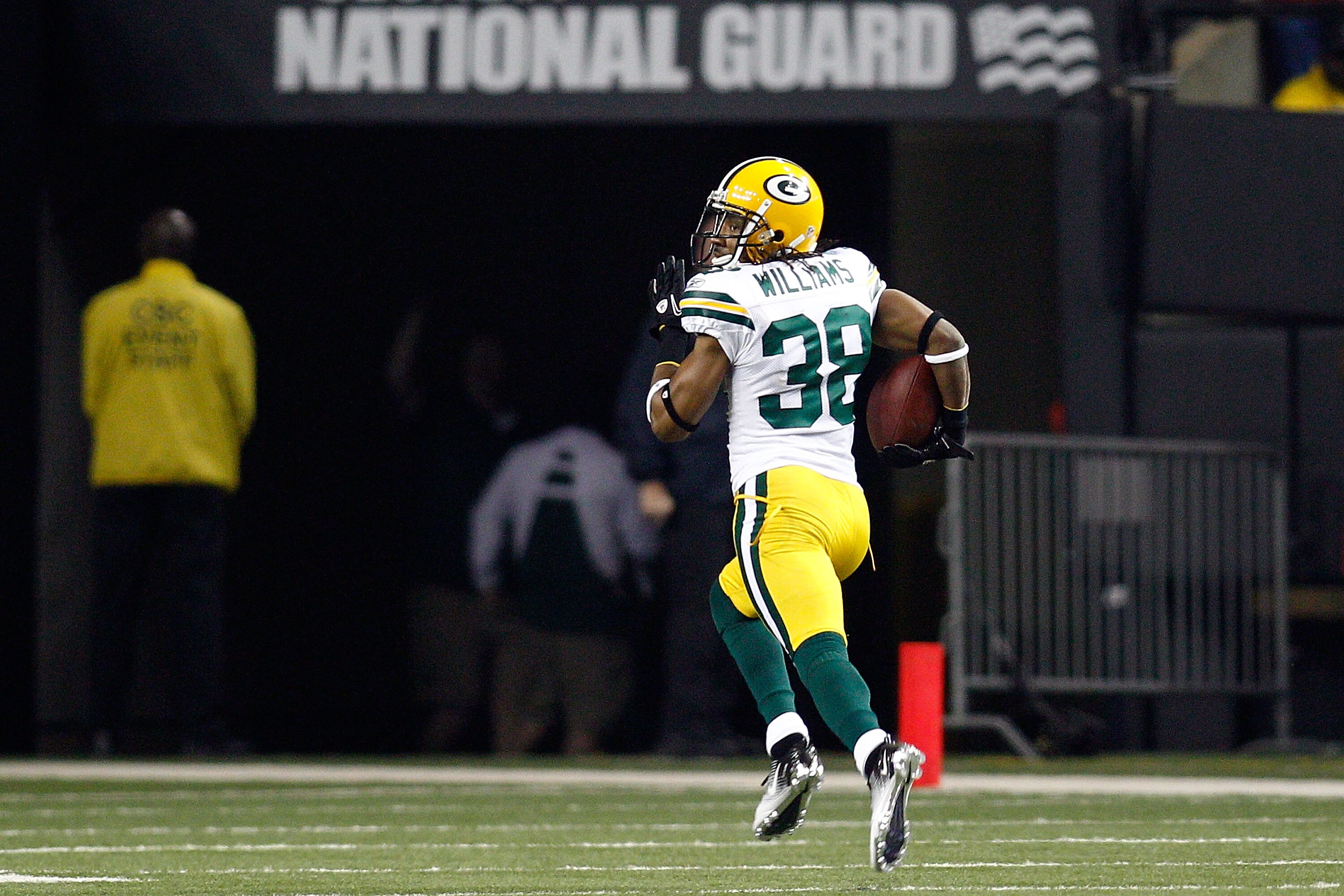 ATLANTA, GA - JANUARY 15:  Tramon Williams ##8 of the Green Bay Packers returns an interception 70-yards for a touchdown in the second quarter against the Atlanta Falcons during their 2011 NFC divisional playoff game at Georgia Dome on January 15, 2011 in