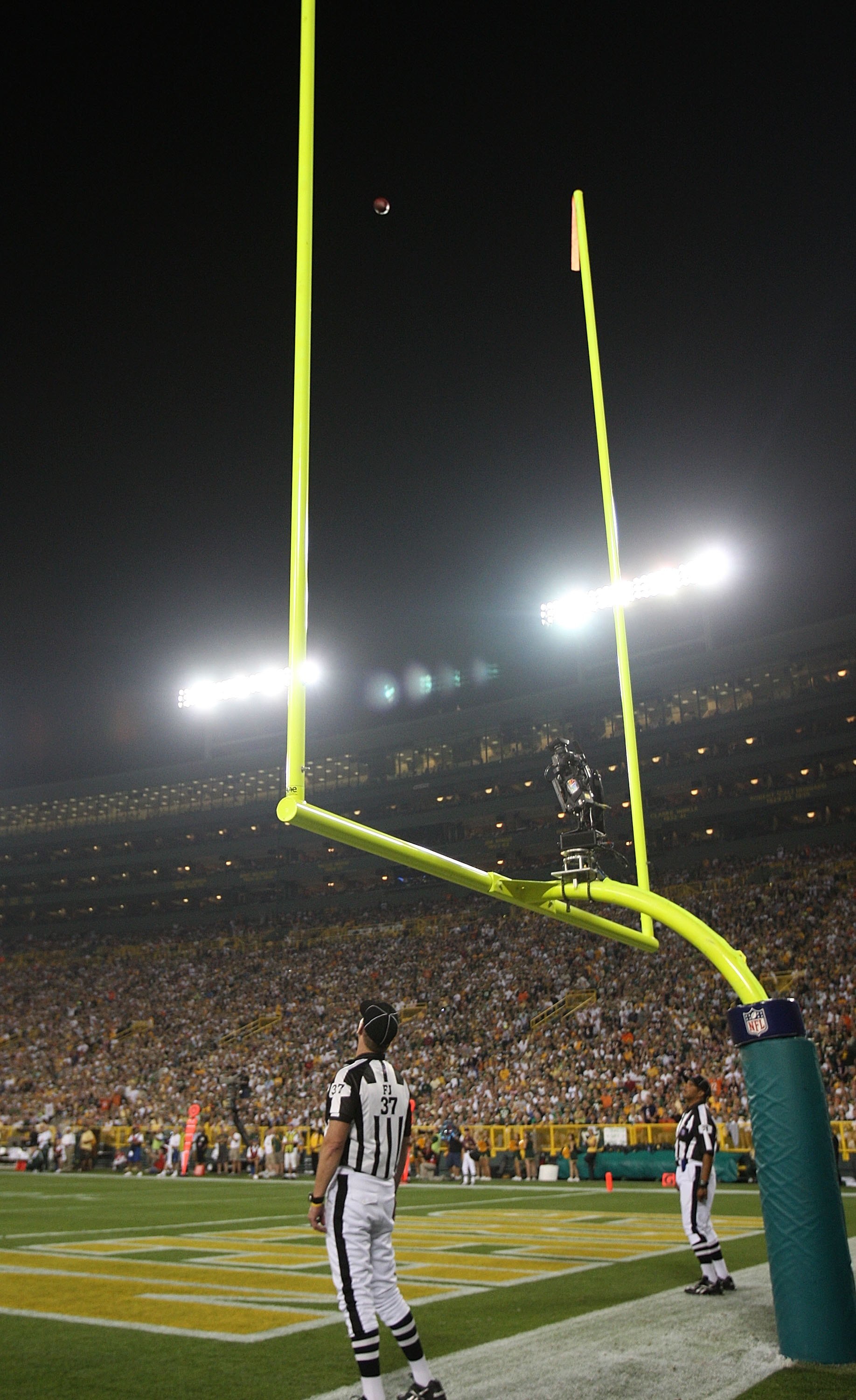 GREEN BAY, WI - SEPTEMBER 13: Referees watch as a ball kicked by Robbie Gould of the Chicago Bears sails through the uprights for 3 points against the Green Bay Packers on September 13, 2009 at Lambeau Field in Green Bay, Wisconsin. The Packers defeated t