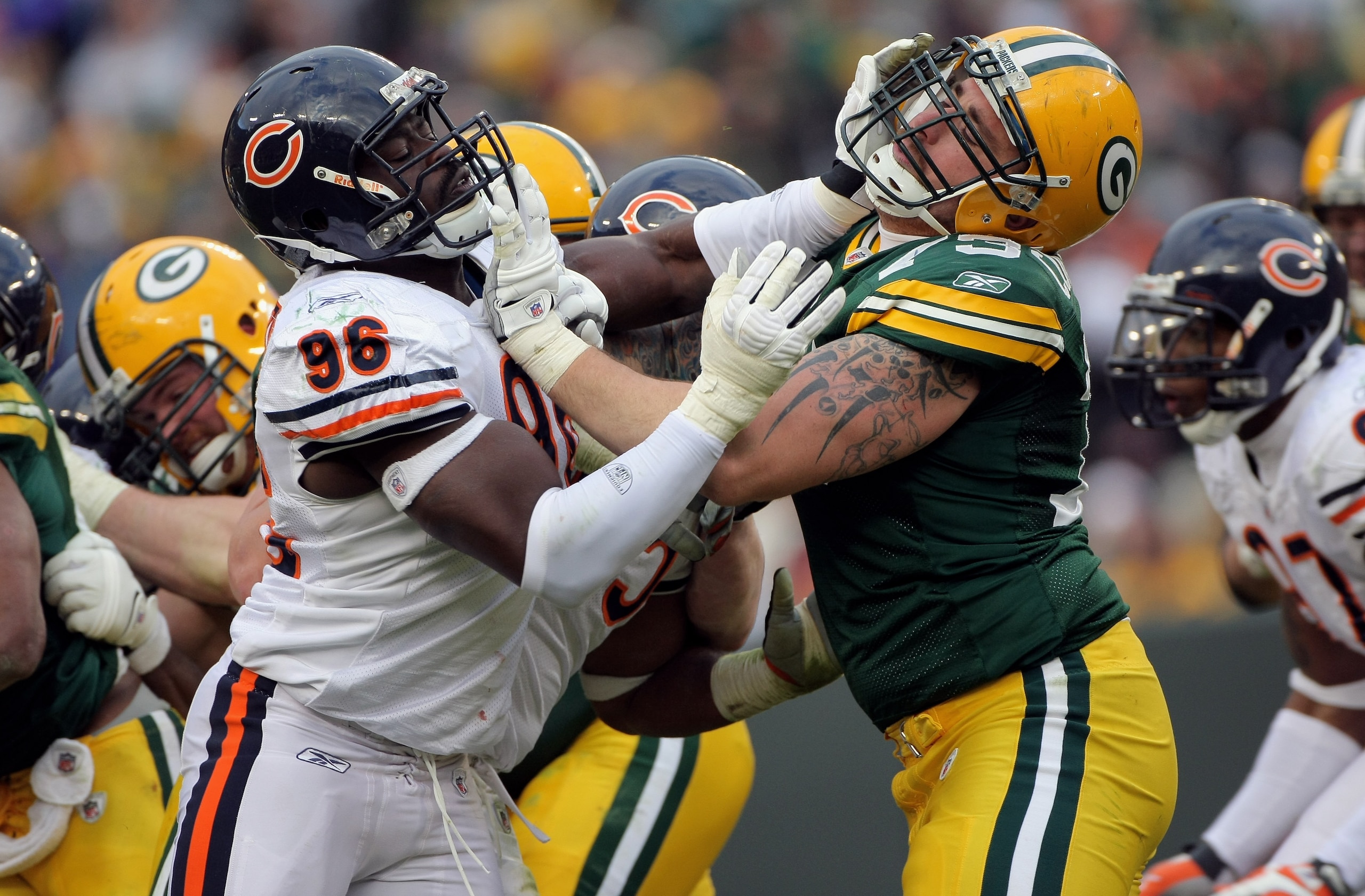 GREEN BAY, WI - NOVEMBER 16:  Defensive end Alex Brown #96 of the Chicago Bears and guard Daryn Colledge #73 of the Green Bay Packers battle at the line of scrimmage during NFL action at Lambeau Field on November 16, 2008 in Green Bay, Wisconsin. The Pack