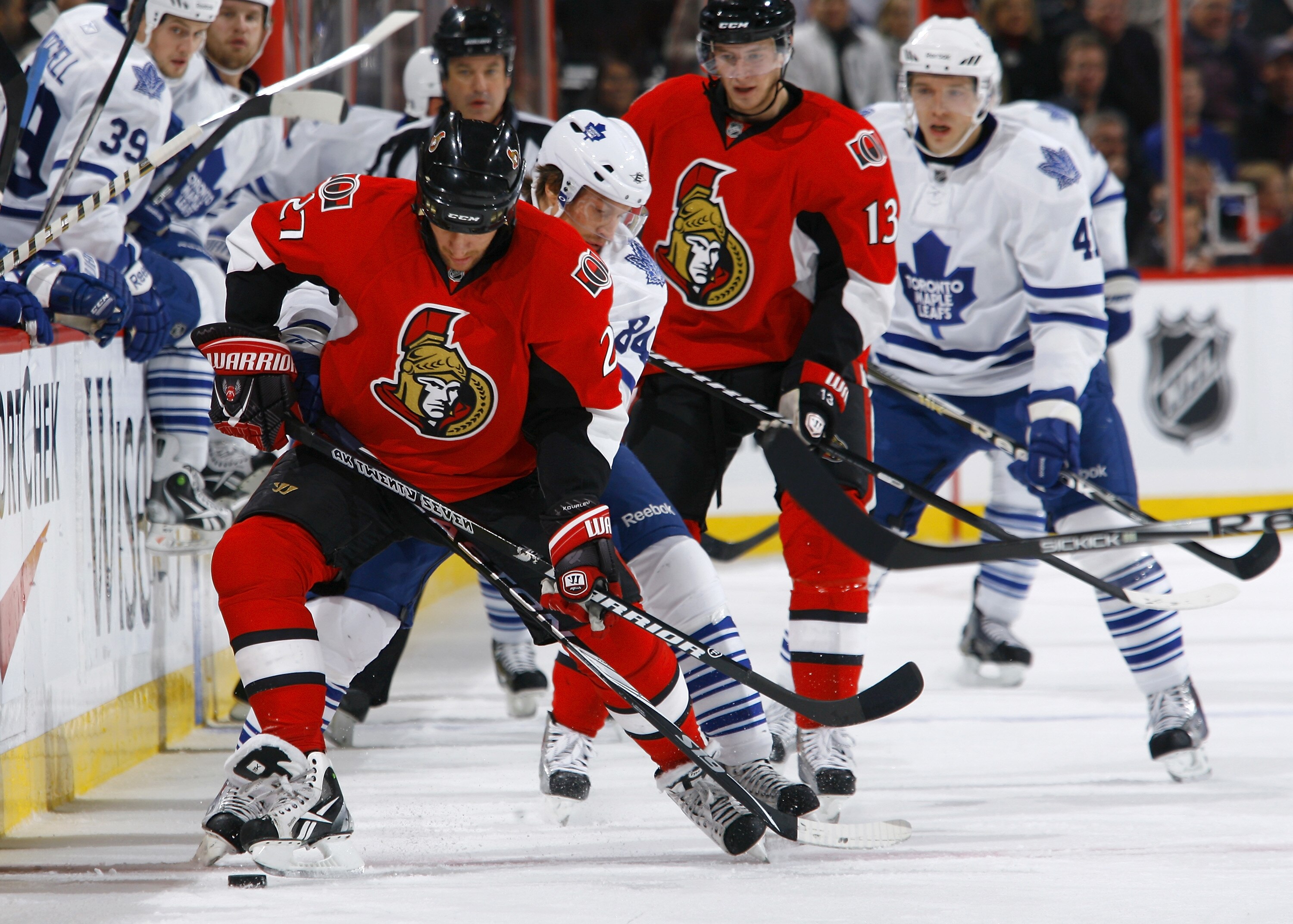 OTTAWA, ON - NOVEMBER 27:  Alex Kovalev #27 of the Ottawa Senators battles for the puck along the near boards with Mikhail Grabovski #84 of the Toronto Maple Leafs during a gam eat Scotiabank Place on November 27, 2010 in Ottawa, Ontario, Canada.  (Photo