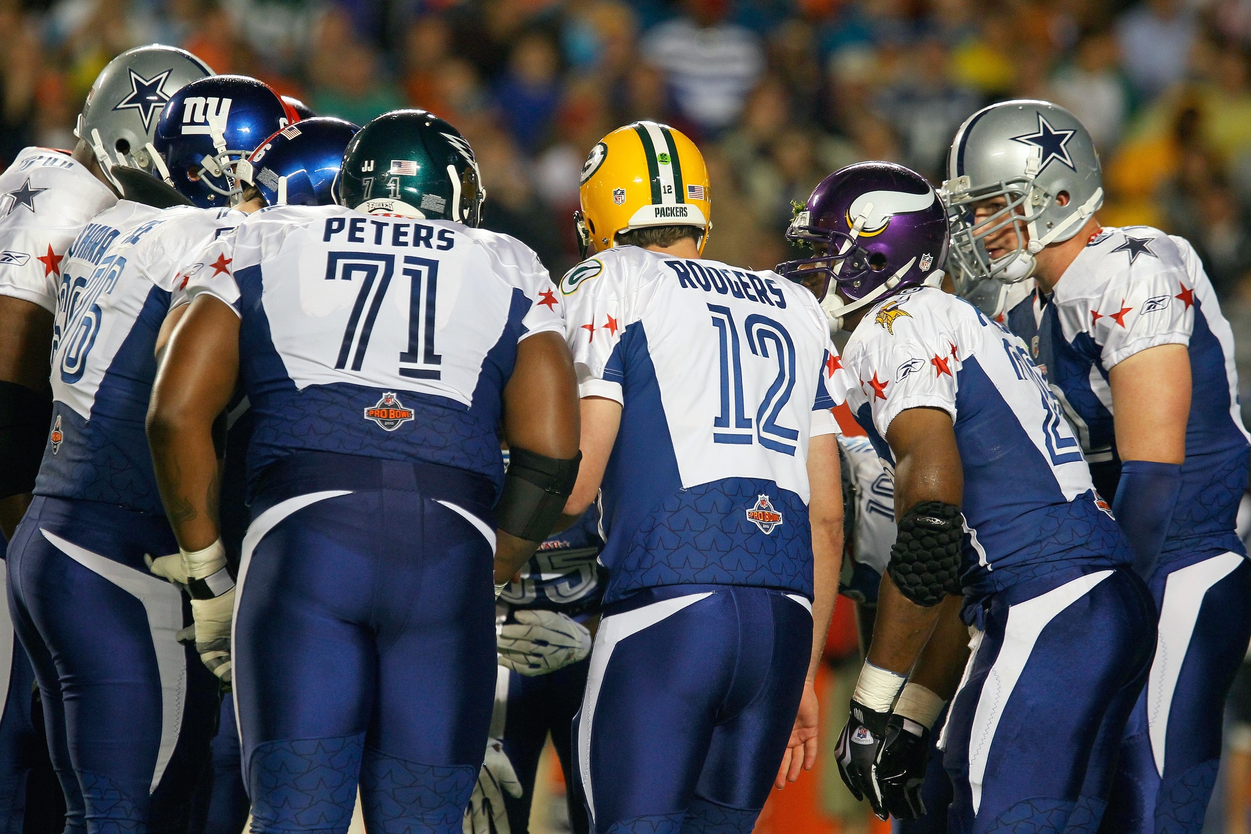 MIAMI GARDENS, FL - JANUARY 31:  The NFC team huddle for the play call during the 2010 AFC-NFC Pro Bowl game at Sun Life Stadium on January 31, 2010 in Miami Gardens, Florida. The AFC defeated the NFC 41-34. (Photo by Scott Halleran/Getty Images)