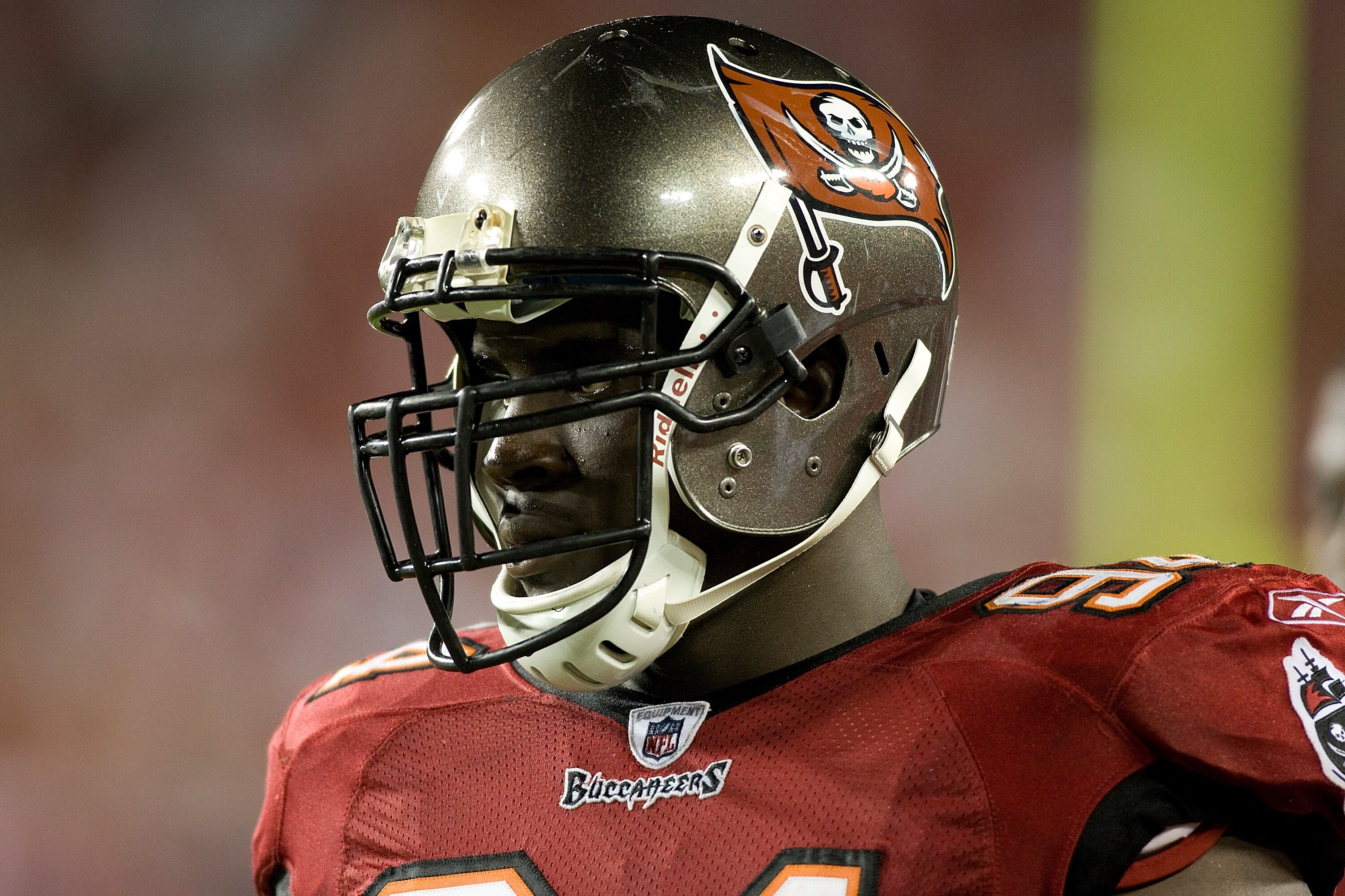 TAMPA, FL - SEPTEMBER 04:  Defensive tackle Kyle Moore #94 of the Tampa Bay Buccaneers watches his team from the bench against the Houston Texans during a preseason game at Raymond James Stadium on September 4, 2009 in Tampa, Florida.  (Photo by J. Meric/