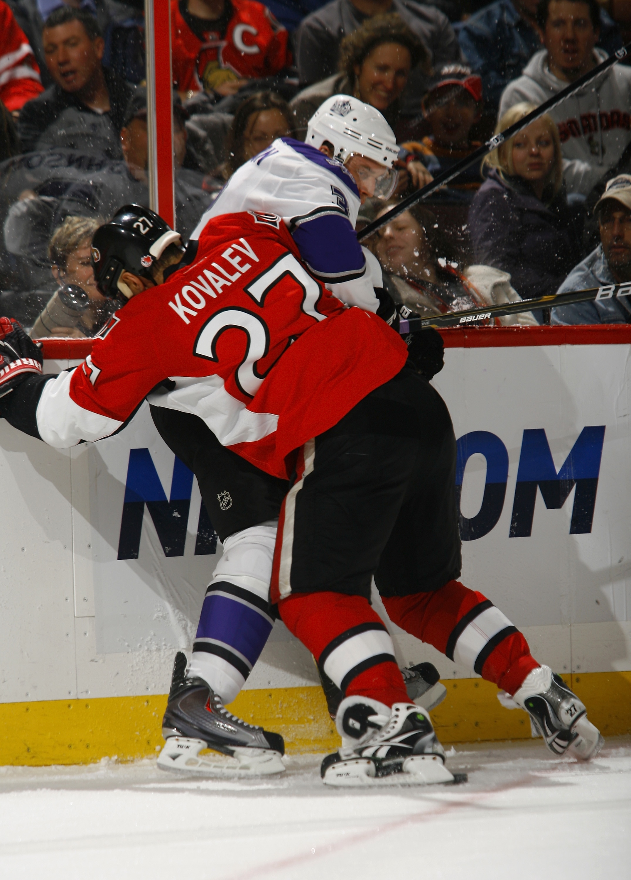 OTTAWA, ON - NOVEMBER 22:  Alex Kovalev #27 of the Ottawa Senators battles along the far boards for the puck with Jack Johnson #3 of the Los Angeles Kings during a game at Scotiabank Place on November 22, 2010 in Ottawa, Ontario, Canada.  (Photo by Philli