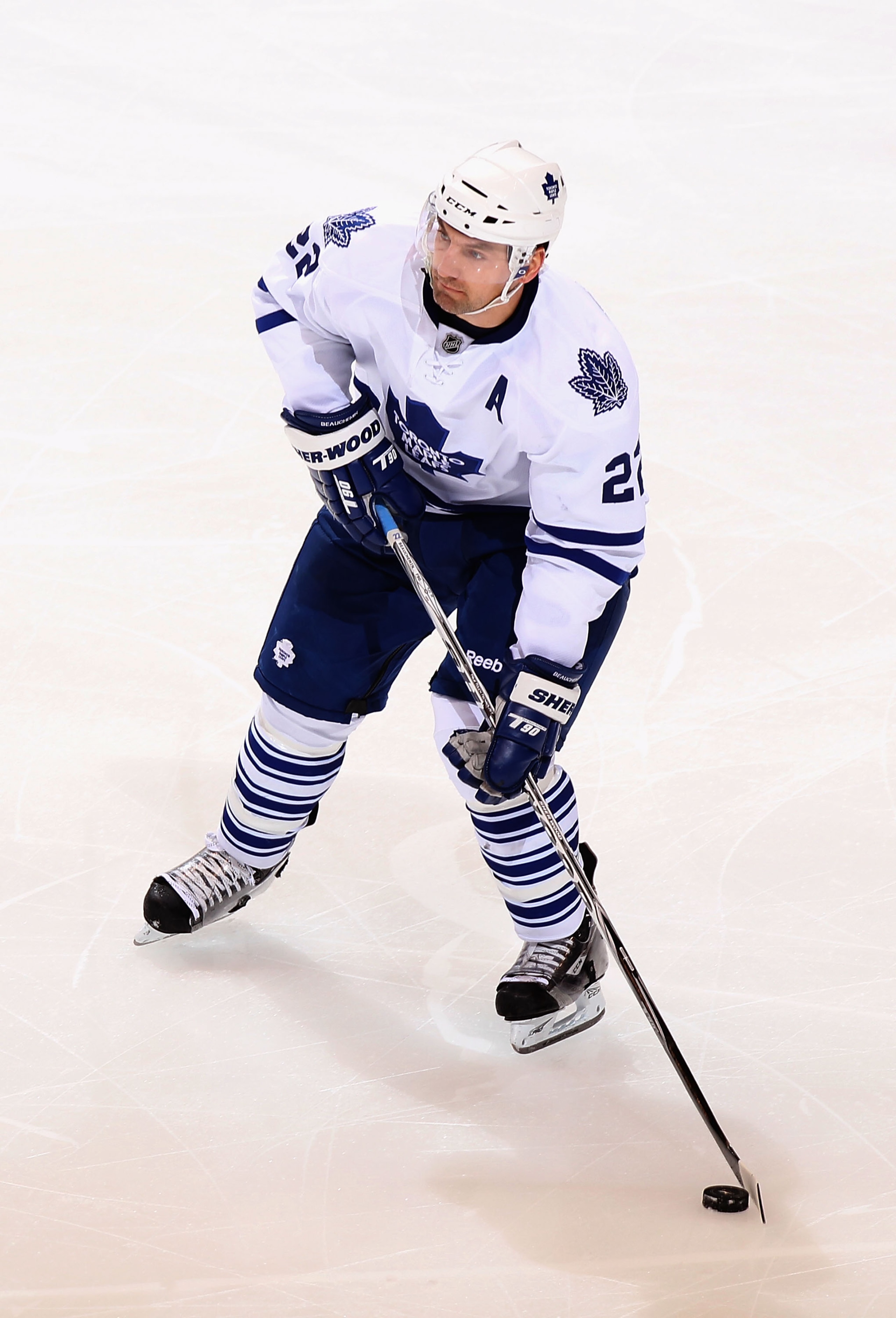 GLENDALE, AZ - JANUARY 13:  Francois Beauchemin #22 of the Toronto Maple Leafs skates with the puck during the NHL game against the Phoenix Coyotes at Jobing.com Arena on January 13, 2011 in Glendale, Arizona. The Coyotes defeated the Maple Leafs 5-1.  (P