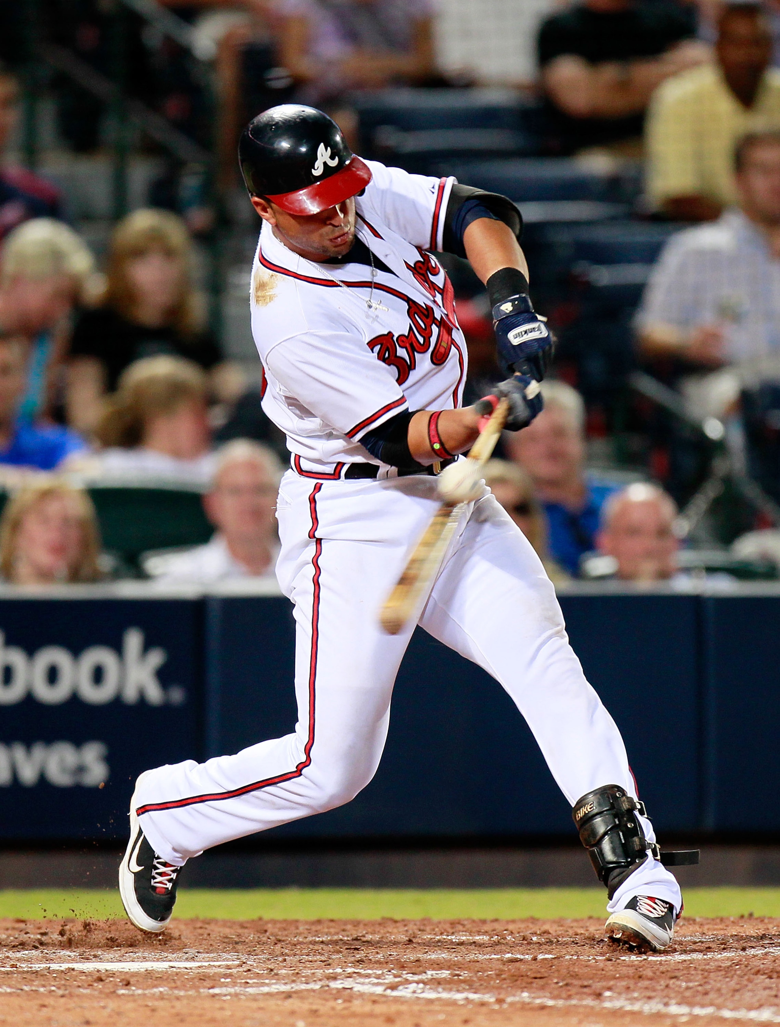 ATLANTA - AUGUST 31:  Martin Prado #14 of the Atlanta Braves hits a single to right field in the fifth inning against the New York Mets at Turner Field on August 31, 2010 in Atlanta, Georgia.  (Photo by Kevin C. Cox/Getty Images)