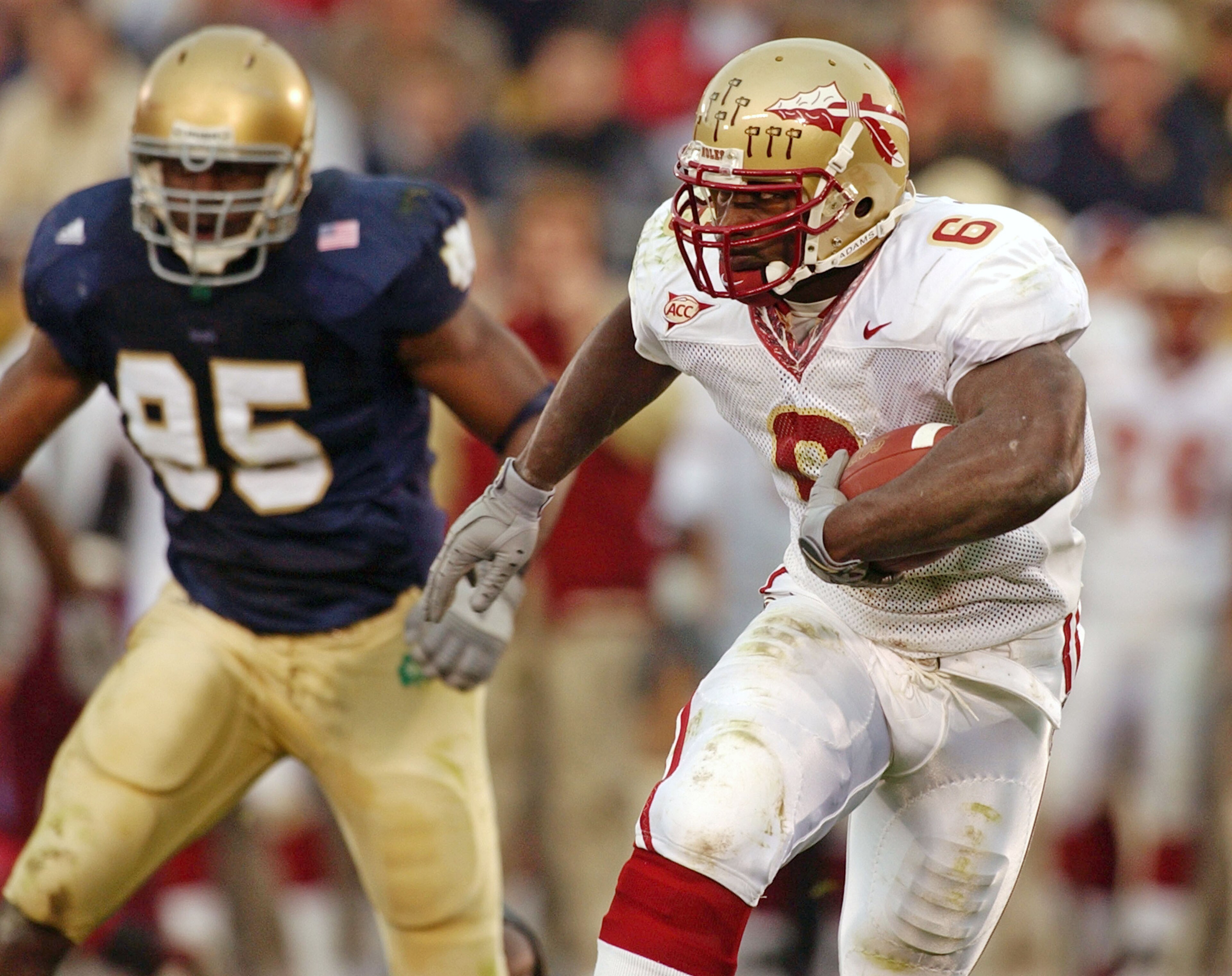 SOUTH BEND, IN - NOVEMBER 1: Tailback Greg Jones #6 of Florida State looks for running room as end Victor Abiamiri #95 of Notre Dame pursues during a game on November 1, 2003 at the Notre Dame Stadium in South Bend, Indiana. (Photo by Jonathan Daniel/Gett SOUTH BEND, IN - NOVEMBER 1: Tailback Greg Jones #6 of Florida State looks for running room as end Victor Abiamiri #95 of Notre Dame pursues during a game on November 1, 2003 at the Notre Dame Stadium in South Bend, Indiana. (Photo by Jonathan Daniel/Gett