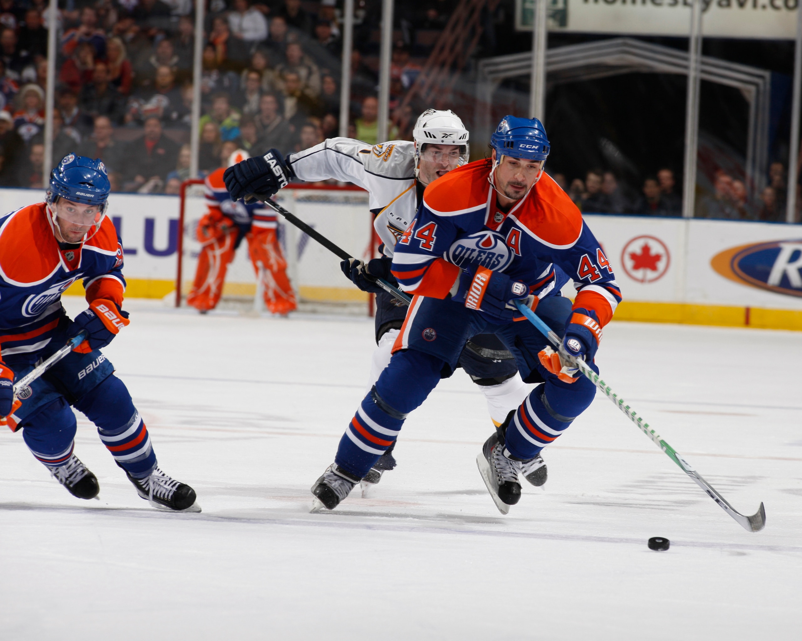 EDMONTON, CANADA - DECEMBER 17:  Sheldon Souray #44 and Sam Gagner #89  of the Edmonton Oilers break up ice against the Nashville Predators on December 17, 2009 at Rexall Place in Edmonton, Alberta, Canada. (Photo by Dale MacMillan/Getty Images)