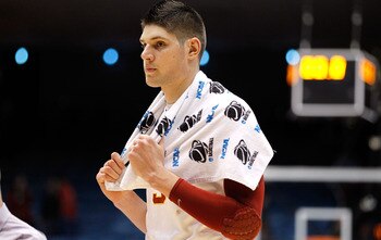 DAYTON, OH - MARCH 16: Nikola Vucevic #5 of the USC Trojans walks off the court after being defeated by the Virginia Commonwealth Rams during the first round of the 2011 NCAA men's basketball tournament at UD Arena on March 16, 2011 in Dayton, Ohio.  (Pho