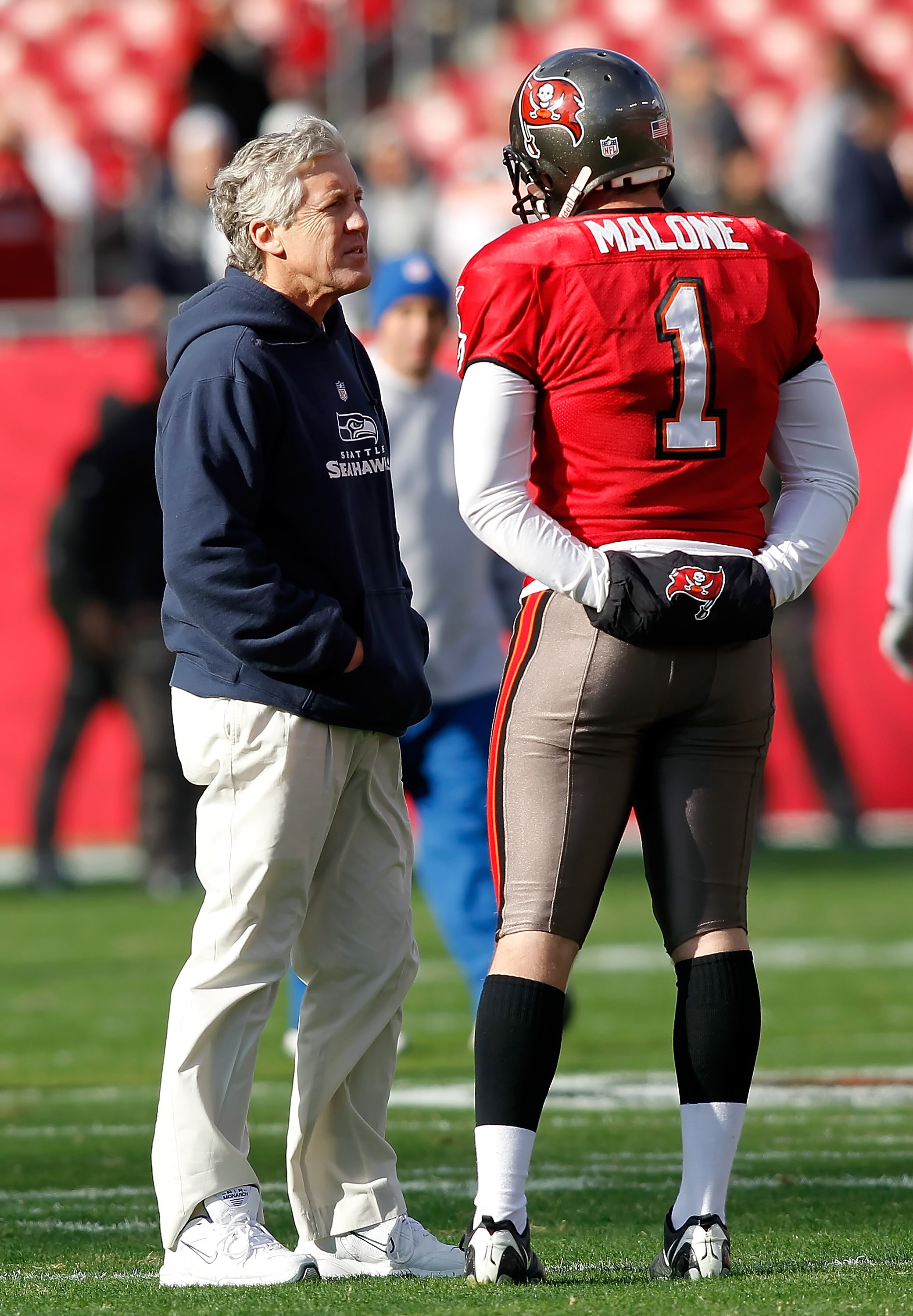 TAMPA, FL - DECEMBER 26:  Head coach Pete Carroll of the Seattle Seahawks talks with punter Robert Malone, #1 of the Tampa Bay Buccaneers just prior to the start of the game against the Tampa Bay Buccaneers at Raymond James Stadium on December 26, 2010 in