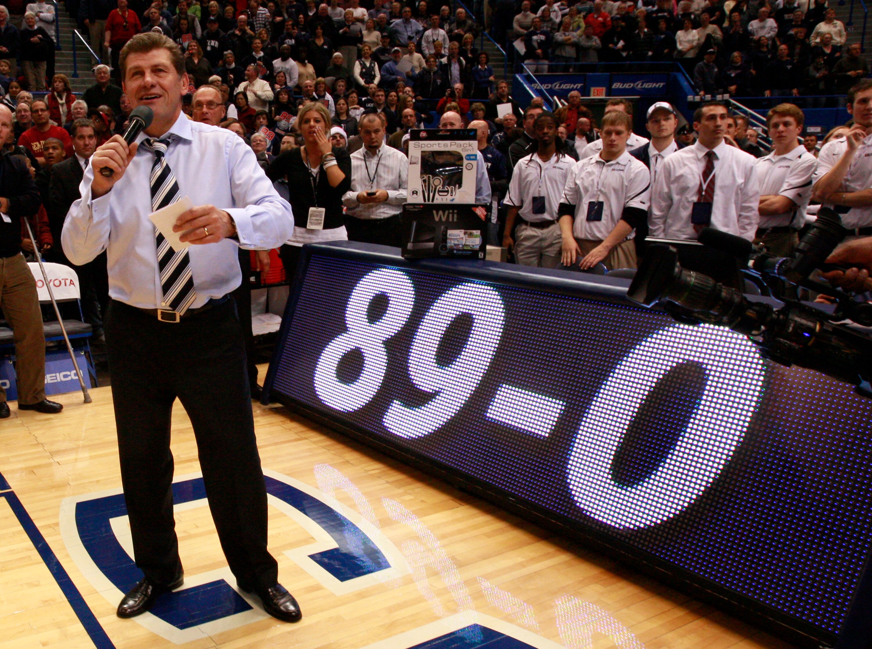 HARTFORD, CT - DECEMBER 21:  Coach Geno Auriemma of Connecticut celebrates a win over  Florida State on December 21, 2010 in Hartford, Connecticut.  Connecticut set a record with 89 straight wins without a defeat. (Photo by Jim Rogash/Getty Images)