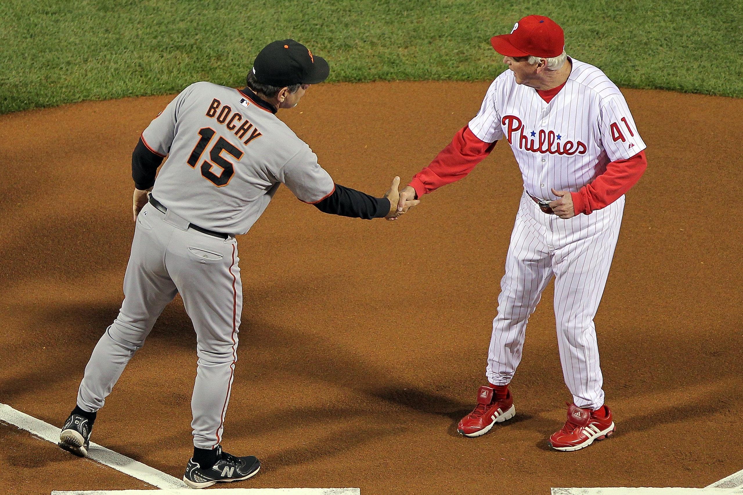 PHILADELPHIA - OCTOBER 16:  Manager Bruce Bochy of the San Francisco Giants shakes hands with manager Charlie Manuel of the Philadelphia Phillies before Game One of the NLCS during the 2010 MLB Playoffs at Citizens Bank Park on October 16, 2010 in Philade