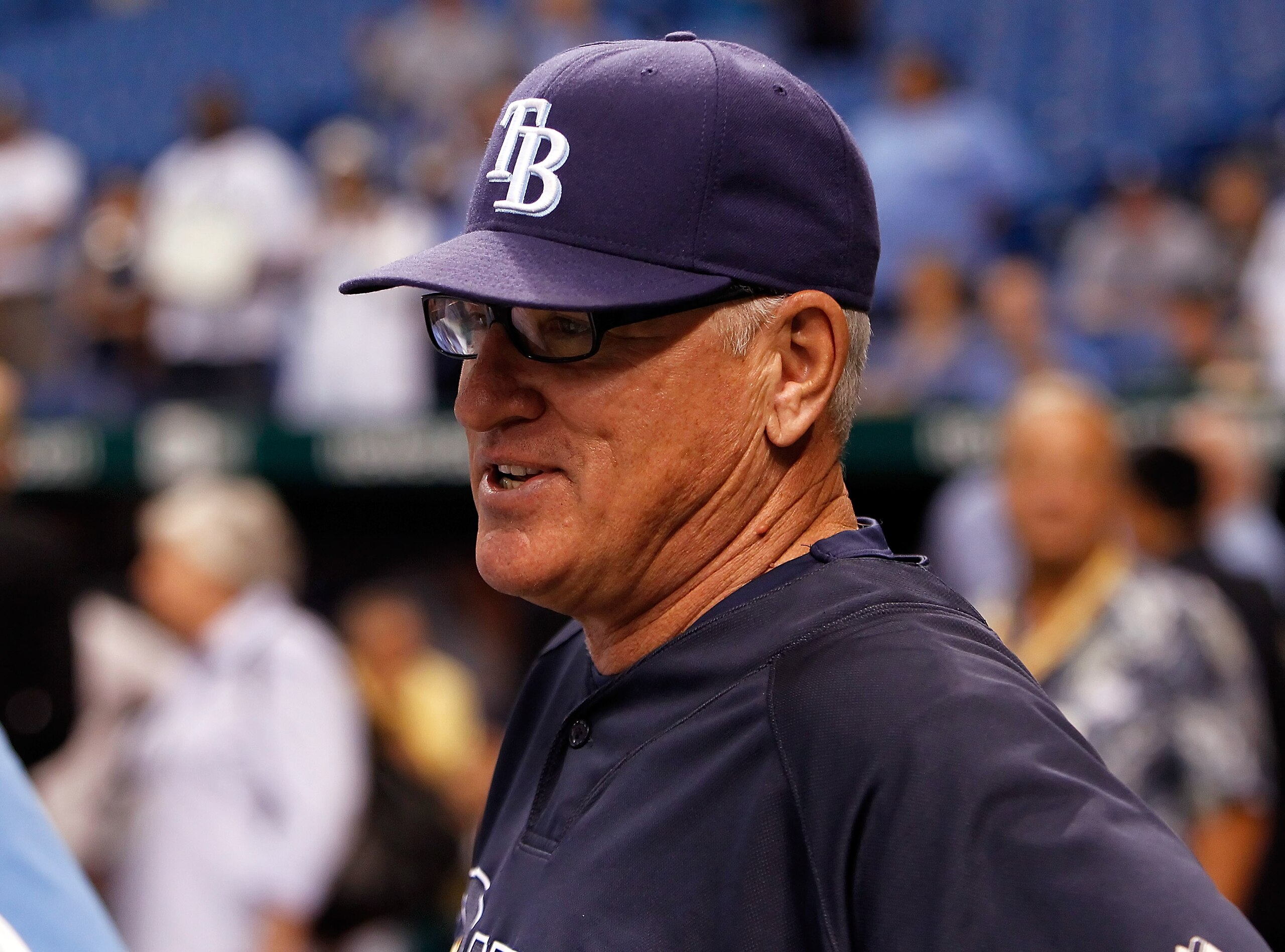 ST. PETERSBURG, FL - OCTOBER 12:  Manager Joe Maddon #70 of the Tampa Bay Rays talks with some reporters during batting practice before the start of Game 5 of the ALDS against the Texas Rangers at Tropicana Field on October 12, 2010 in St. Petersburg, Flo