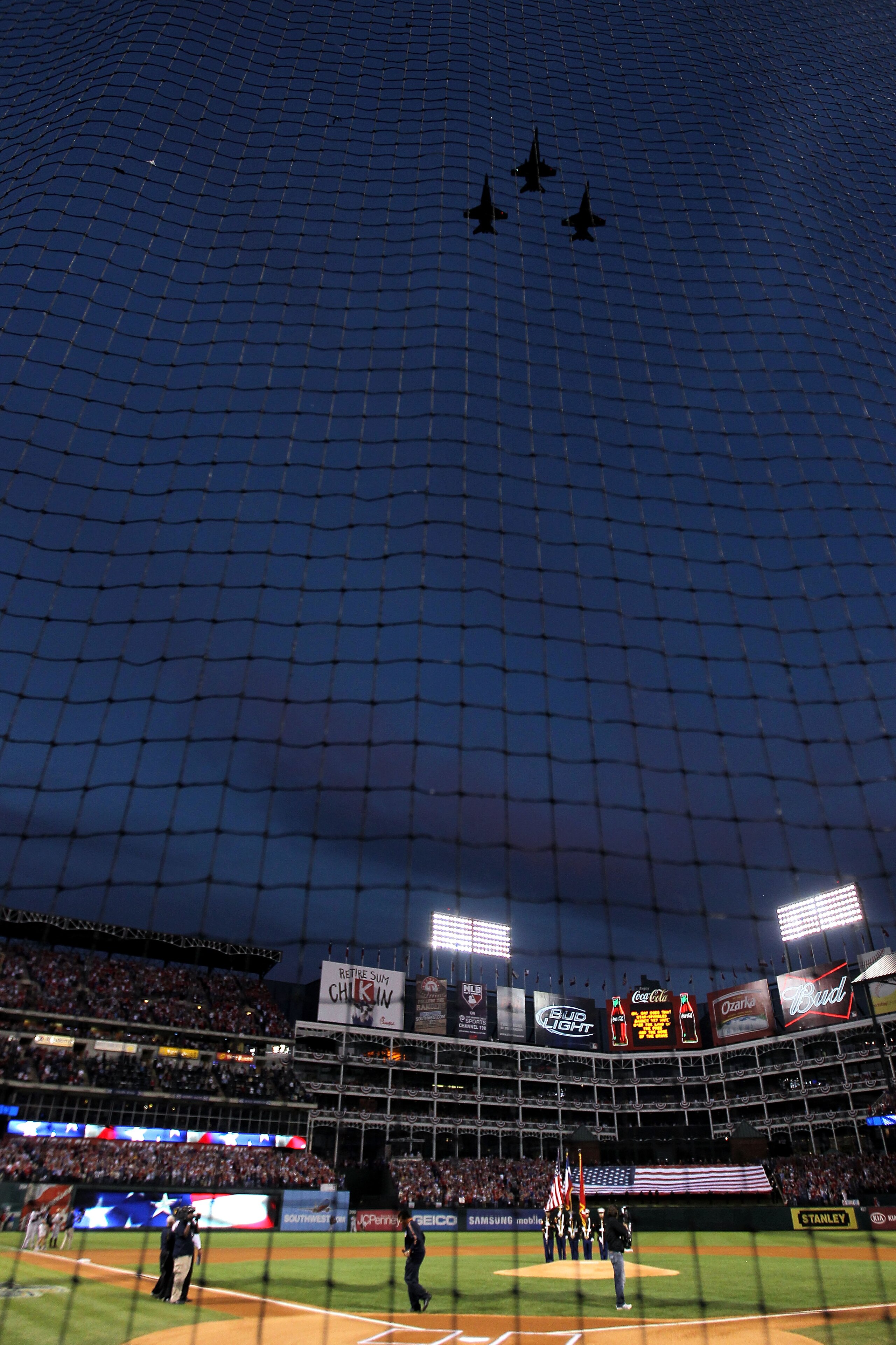 ARLINGTON, TX - NOVEMBER 01:  Jets perform a fly over during the performance of the National Anthem prior to the Texas Rangers playing against the San Francisco Giants in Game Five of the 2010 MLB World Series at Rangers Ballpark in Arlington on November