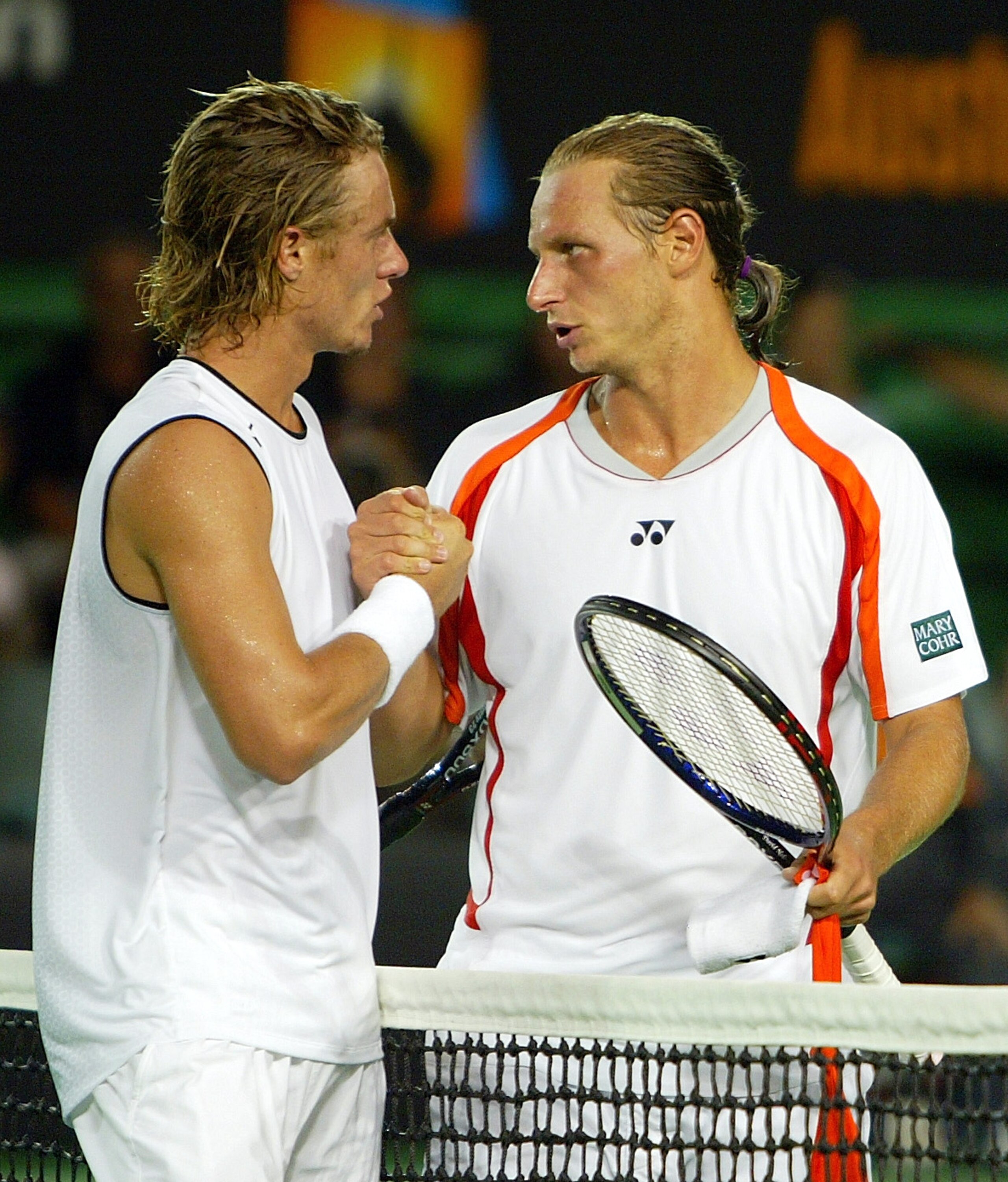 MELBOURNE, AUSTRALIA - JANUARY 26: Lleyton Hewitt of Australia is congratulated by David Nalbandian of Argentina after winning their match during day ten of the Australian Open Grand Slam at Melbourne Park January 26, 2005 in Melbourne, Australia. (Photo