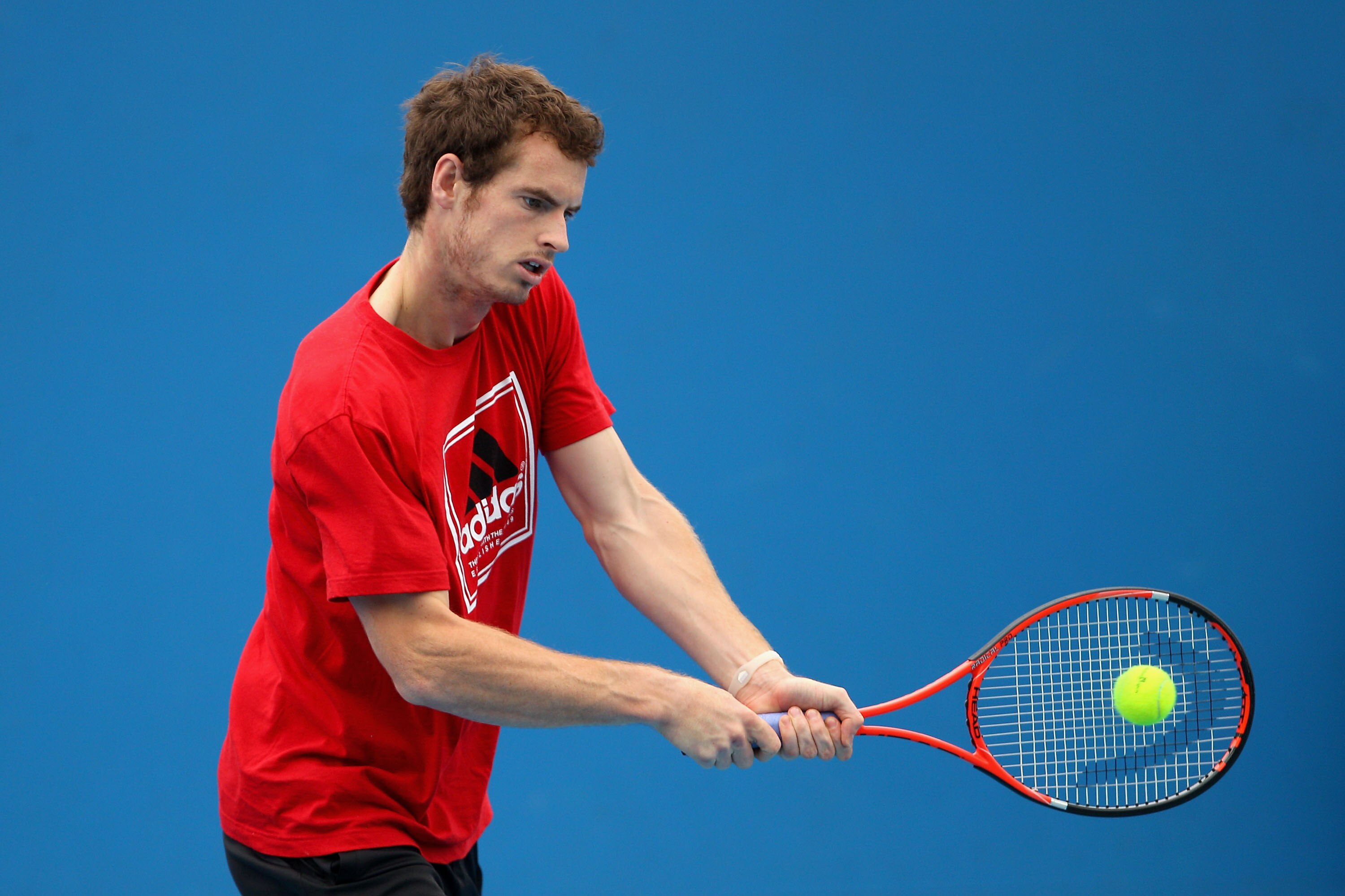 MELBOURNE, AUSTRALIA - JANUARY 17:  Andy Murray of Great Britain plays a backhand during a practice session on day one of the 2011 Australian Open at Melbourne Park on January 17, 2011 in Melbourne, Australia.  (Photo by Lucas Dawson/Getty Images)