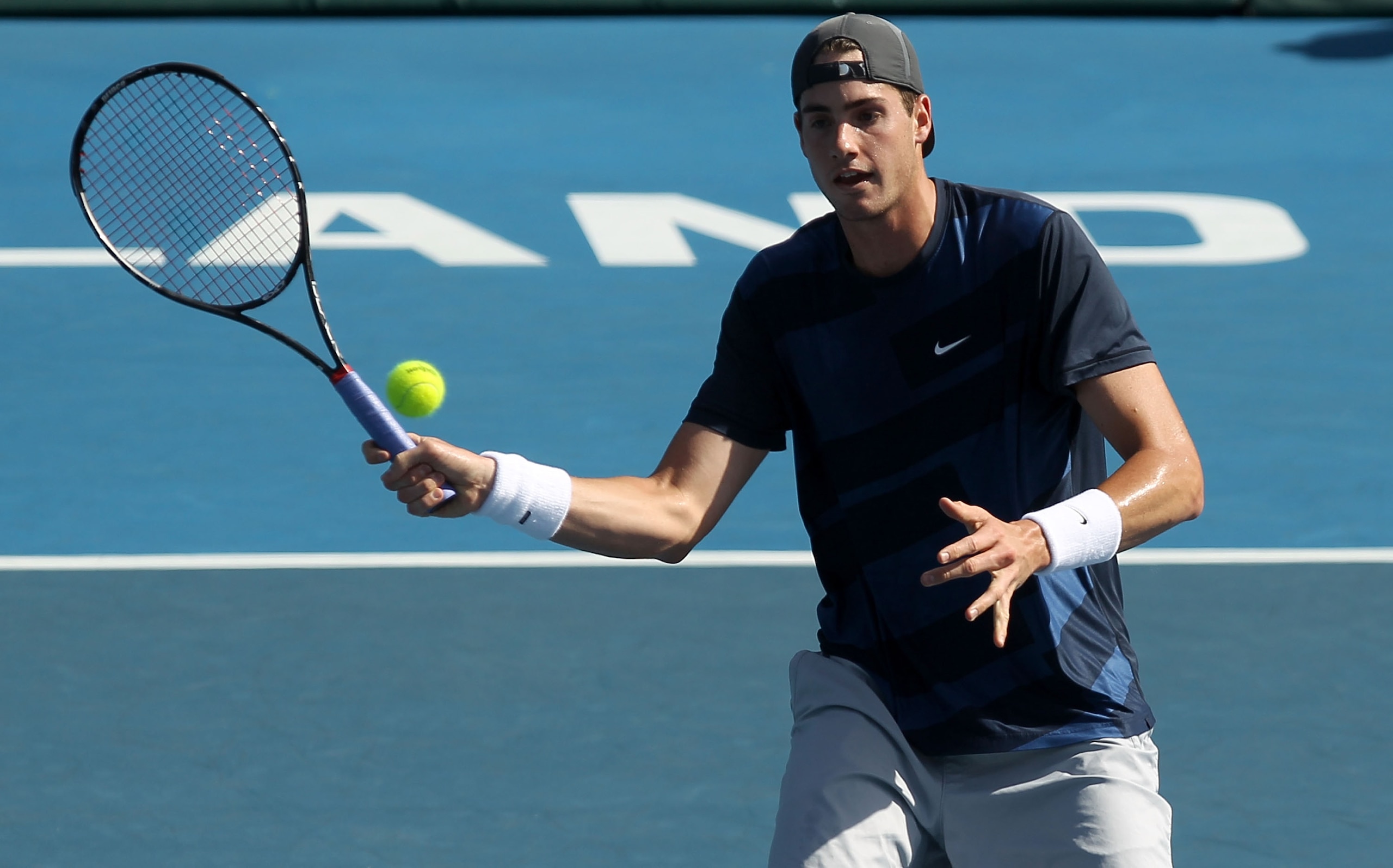 AUCKLAND, NEW ZEALAND - JANUARY 13:  John Isner of the USA plays a forehand during his match against David Nalbandian of Argentina on day four of the Heineken Open at the ASB Tennis Centre on January 13, 2011 in Auckland, New Zealand.  (Photo by Phil Walt