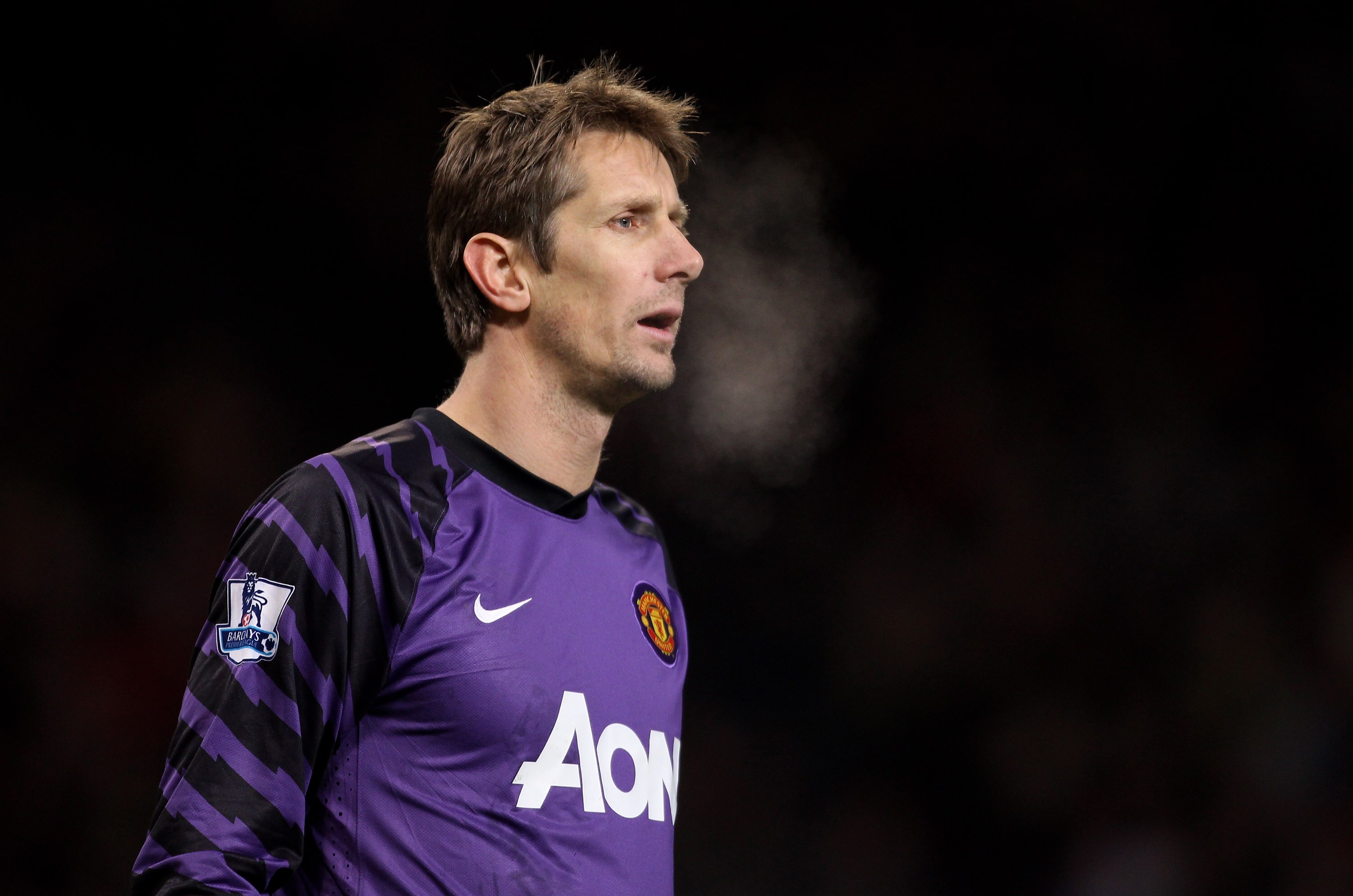 MANCHESTER, ENGLAND - DECEMBER 13:  Edwin van der Sar of Manchester United  looks on during the Barclays Premier League match between Manchester United and Arsenal at Old Trafford on December 13, 2010 in Manchester, England.  (Photo by Alex Livesey/Getty