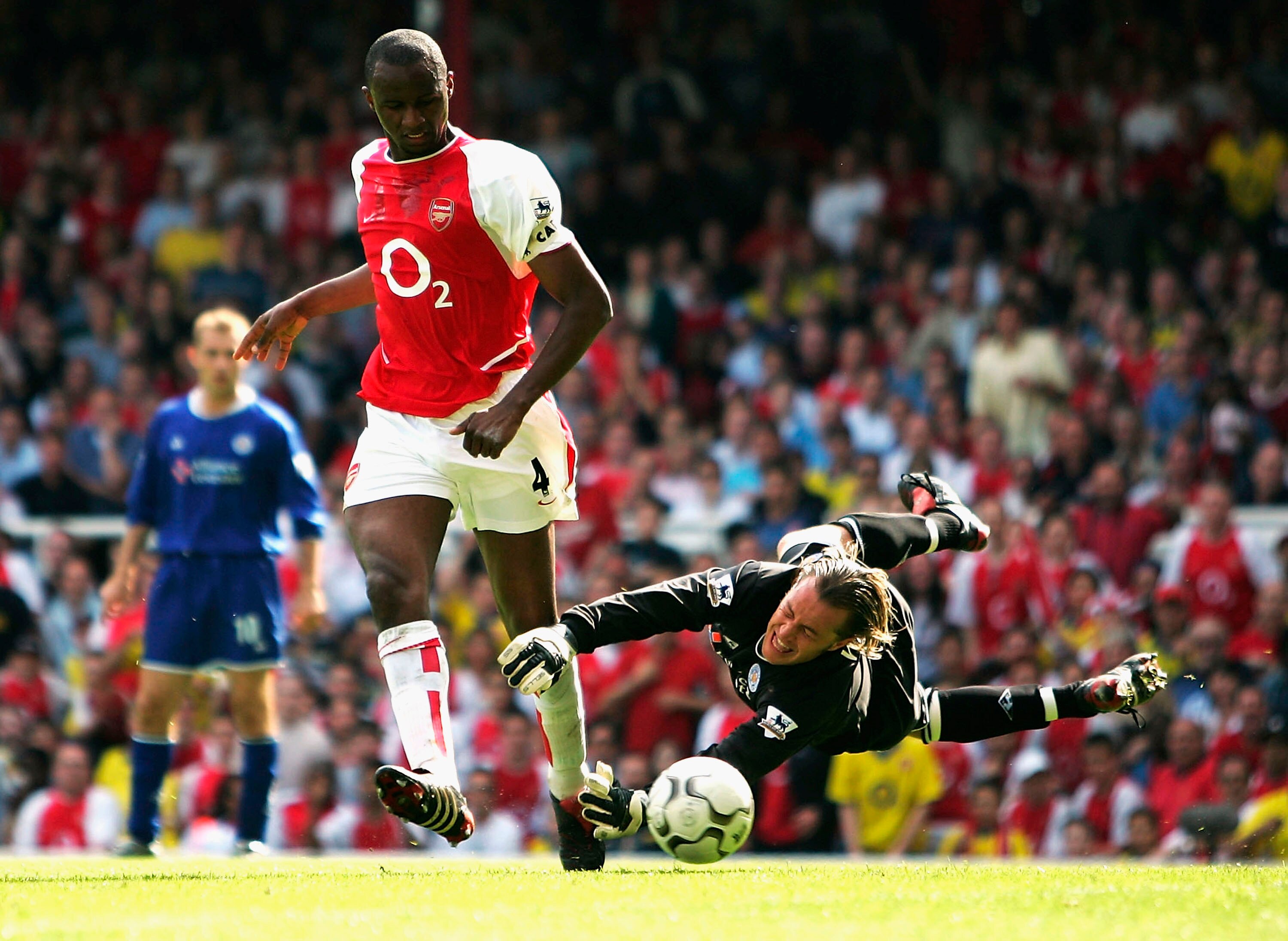 LONDON - MAY 15:  Patrick Vieira of Arsenal scores their second goal during the FA Barclaycard Premiership match between Arsenal and Leicester City at Highbury on May 15, 2004 in London.  (Photo by Clive Mason/Getty Images)