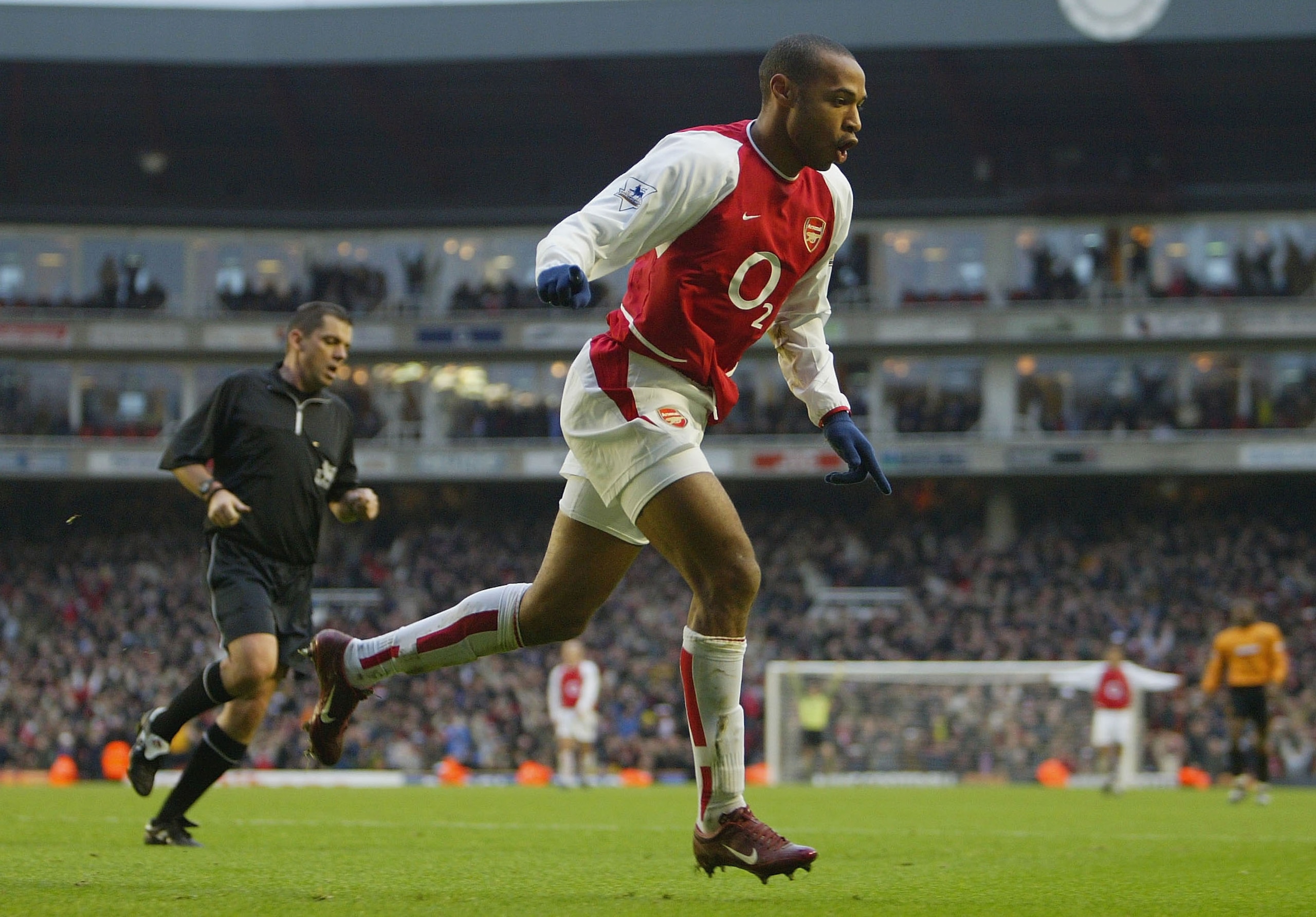 LONDON - DECEMBER 26:  Thierry Henry of Arsenal celebrates scoring his second goal during the FA Barclaycard Premiership match between Arsenal and Wolverhampton Wanderers at Highbury on December 26, 2003 in London.  (Photo by Clive Mason/Getty Images)