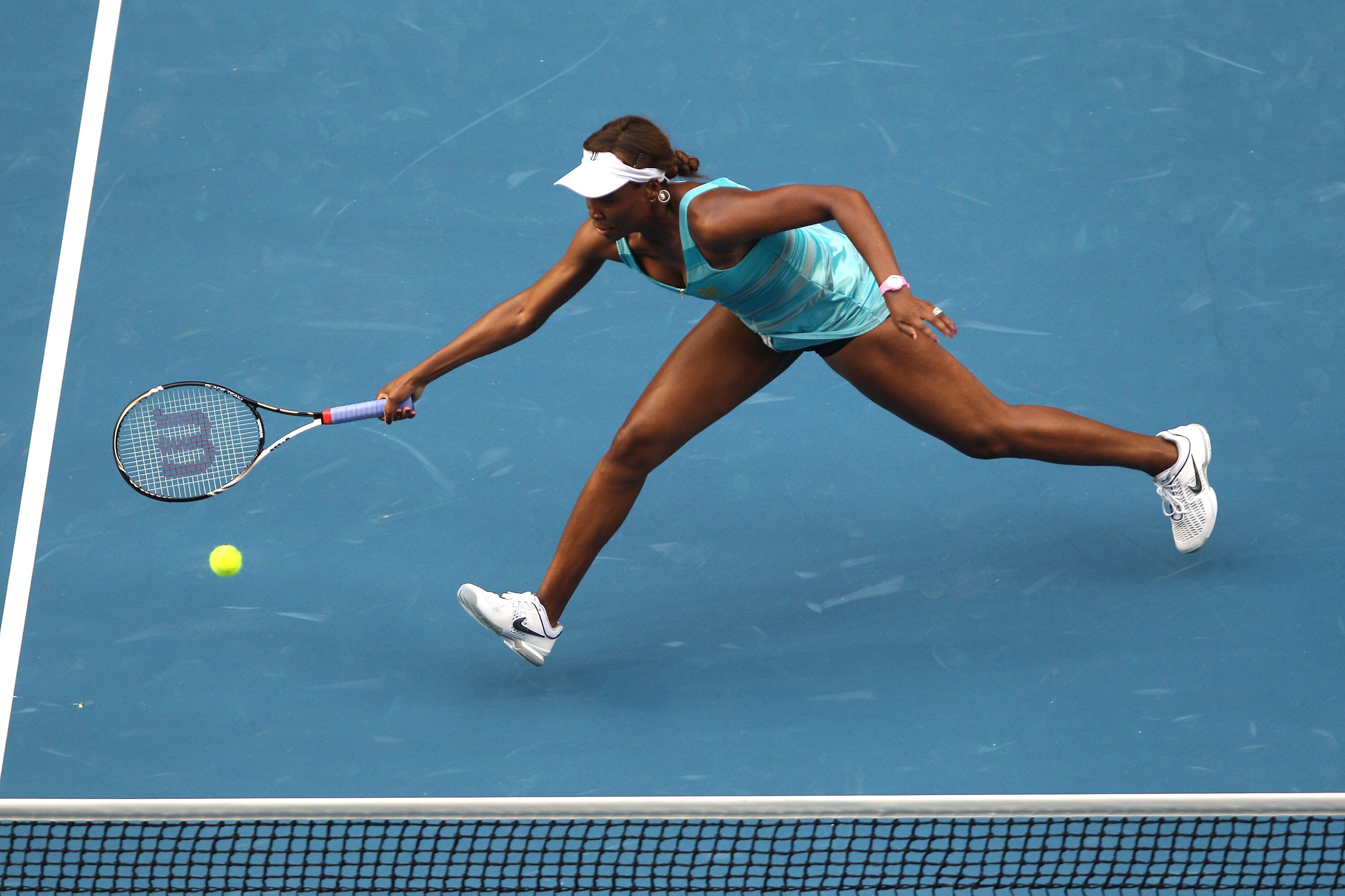 MELBOURNE, AUSTRALIA - JANUARY 17:  Venus Williams of the United States of America plays a forehand in her first round match against Sara Errani of Italy during day one of the 2011 Australian Open at Melbourne Park on January 17, 2011 in Melbourne, Austra