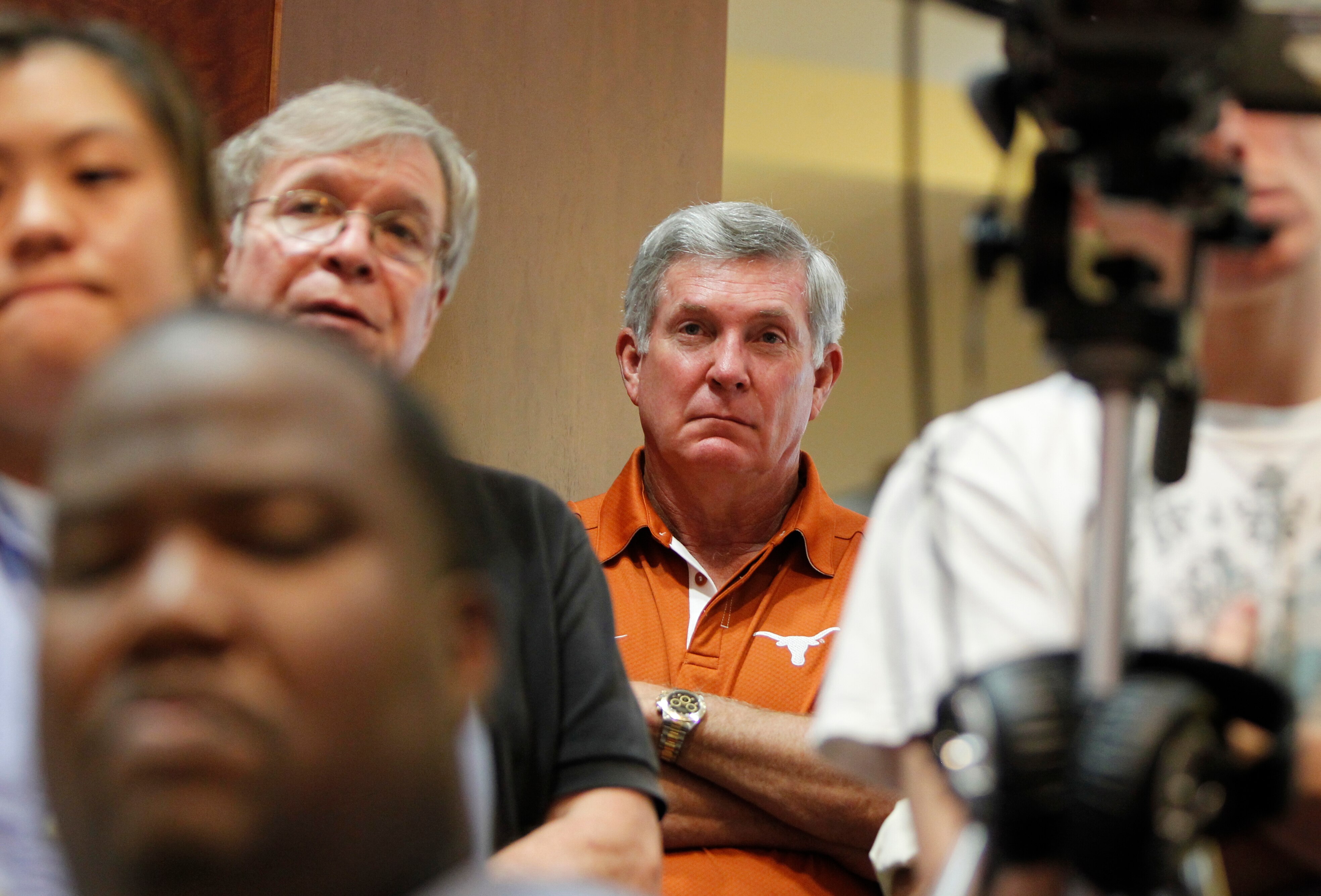 AUSTIN, TX - JUNE 15:  University of Texas at Austin football head coach Mack Brown listens as university officials announce the athletics programs will continue competing in the Big 12 Conference June 15, 2010 in Austin, Texas.  (Photo by Erich Schlegel/