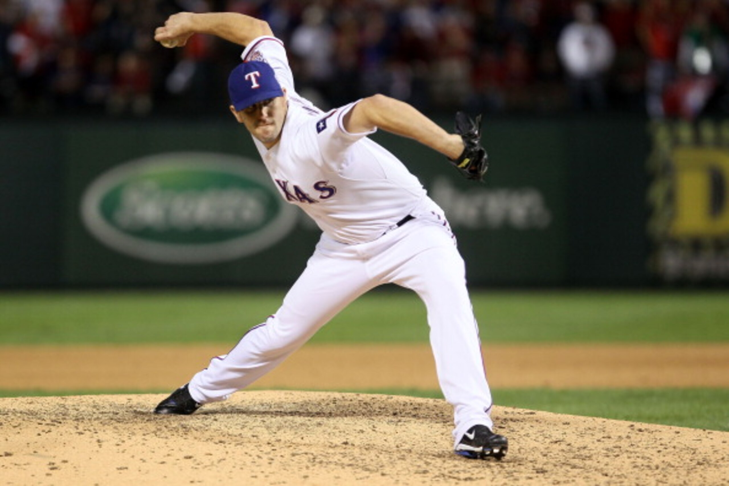 ARLINGTON, TX - OCTOBER 30:  Darren O'Day #56 of the Texas Rangers pitches against the San Francisco Giants in Game Three of the 2010 MLB World Series at Rangers Ballpark in Arlington on October 30, 2010 in Arlington, Texas.  (Photo by Elsa/Getty Images)