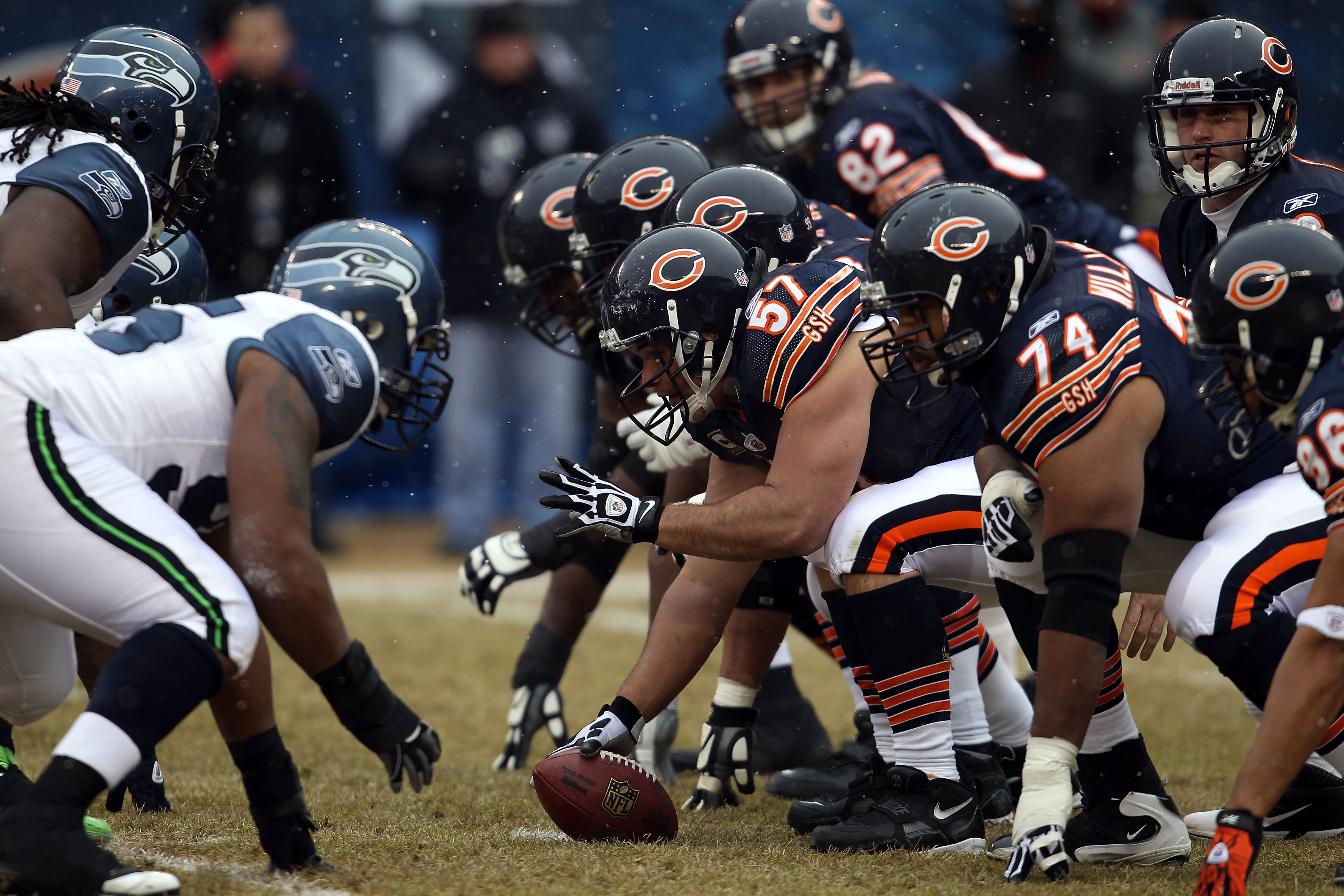 CHICAGO, IL - JANUARY 16:  Center Olin Kreutz #57 of the Chicago Bears prepares to snap the ball against the Seattle Seahawks in the first half in the 2011 NFC divisional playoff game at Soldier Field on January 16, 2011 in Chicago, Illinois.  (Photo by J