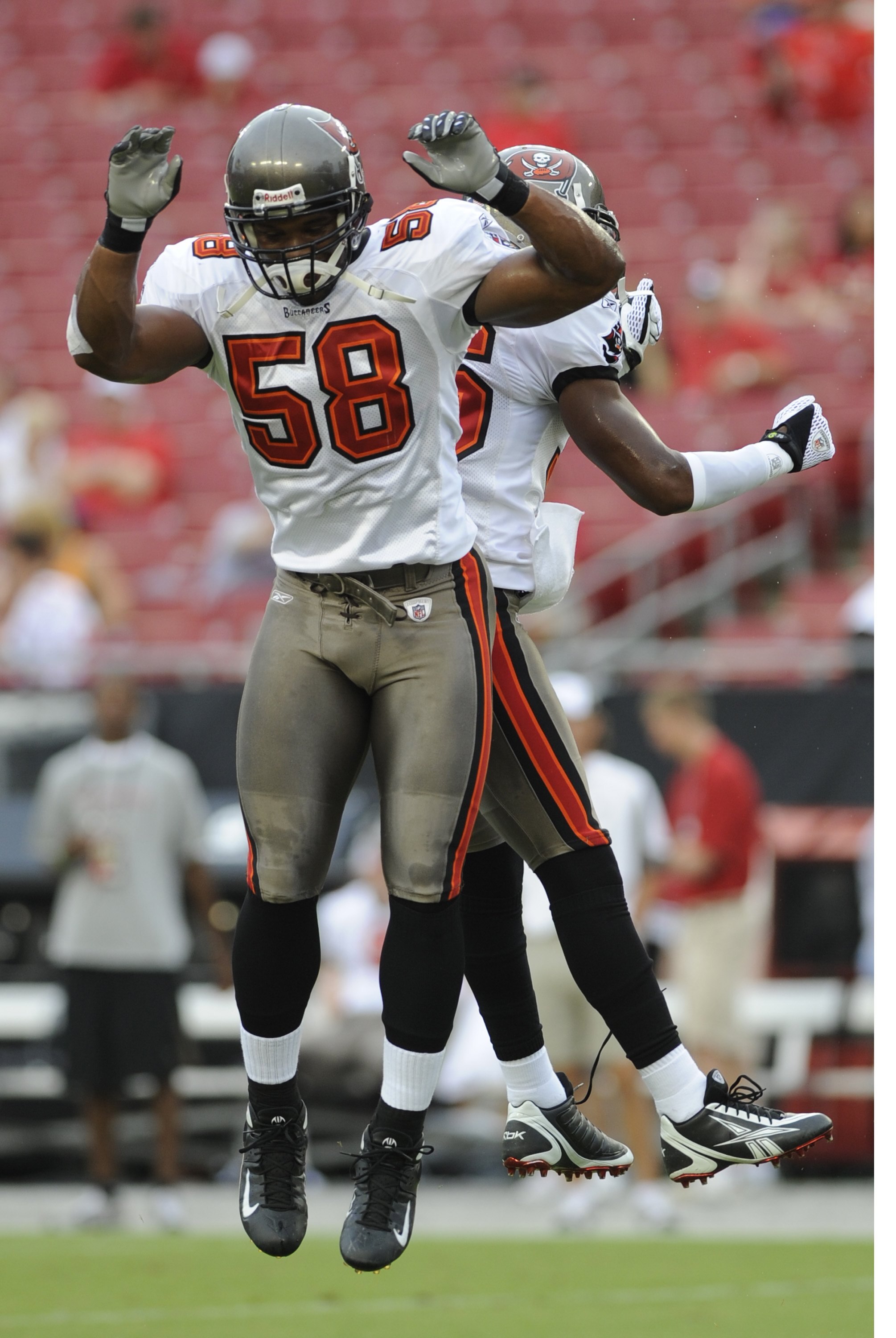 TAMPA, FL - AUGUST 23: Linebacker Quincy Black #58 of the Tampa Bay Buccaneers practices a celebration jump during warmups against the Jacksonville Jaguars at Raymond James Stadium on August 23, 2008 in Tampa, Florida.   (Photo by Al Messerschmidt/Getty I