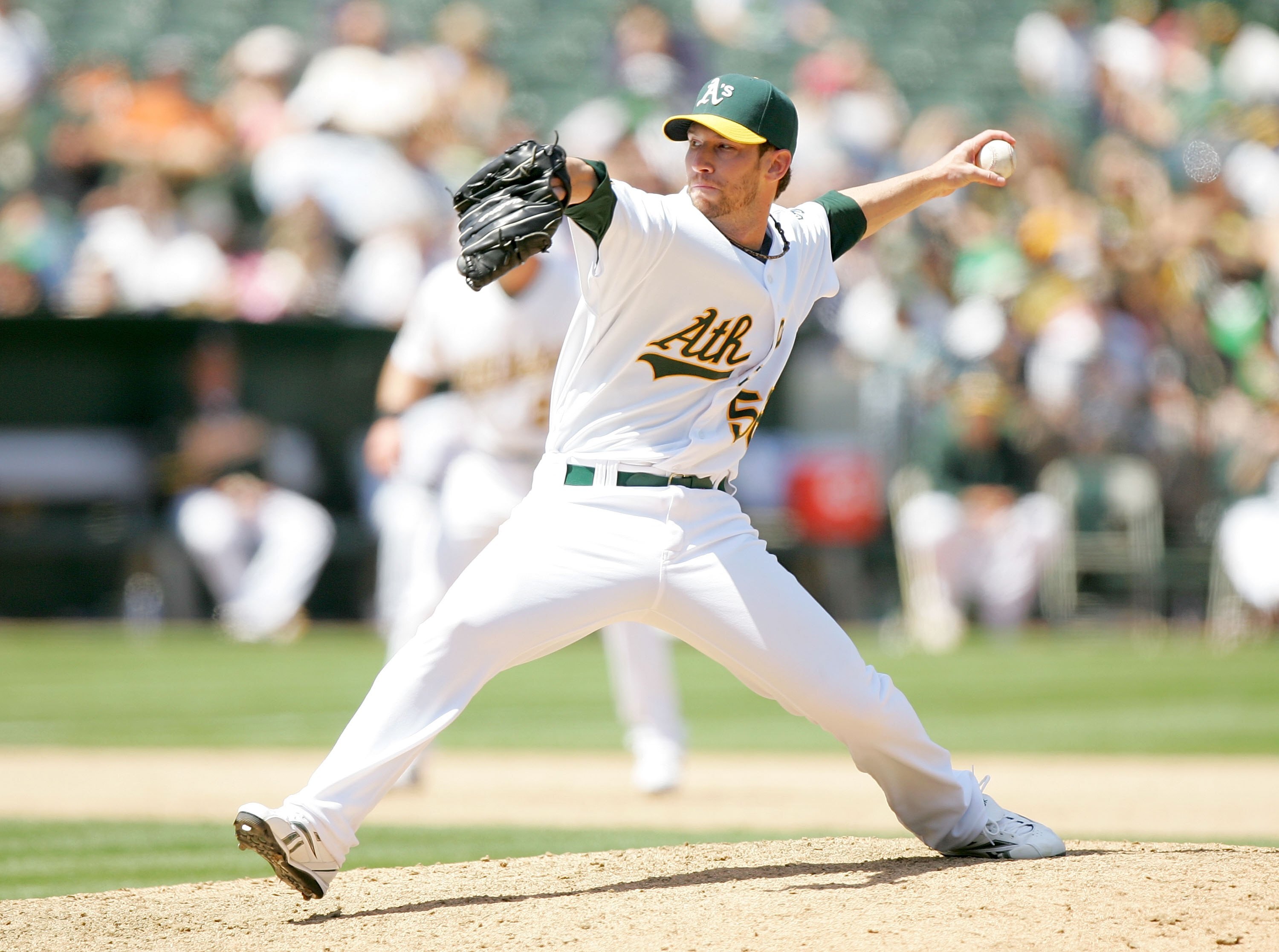 OAKLAND, CA - MAY 27:  Craig Breslow #56 of the Oakland Athletics pitches to the Seattle Mariners at the Oakland Coliseum on May 27, 2009 in Oakland, California.  (Photo by Ezra Shaw/Getty Images)