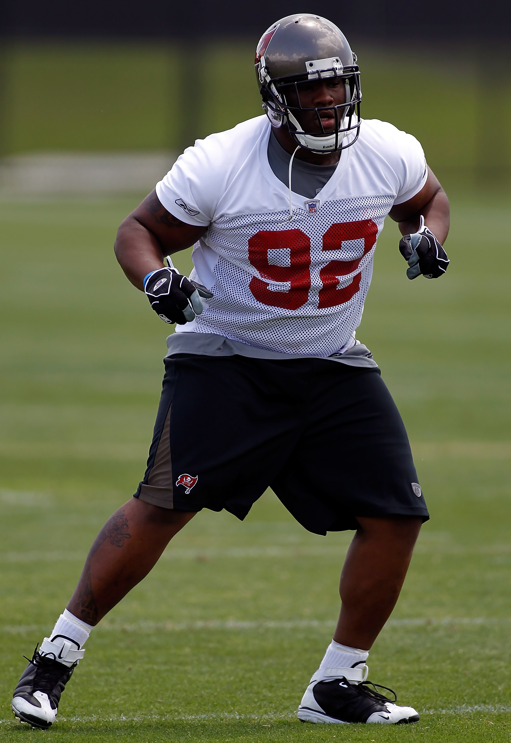 TAMPA, FL - MAY 01:  Defensive tackle Brian Price #92 of the Tampa Bay Buccaneers warms up during the Buccaneers Rookie mini camp at One Buccaneer Place on May 1, 2010 in Tampa, Florida.  (Photo by J. Meric/Getty Images)