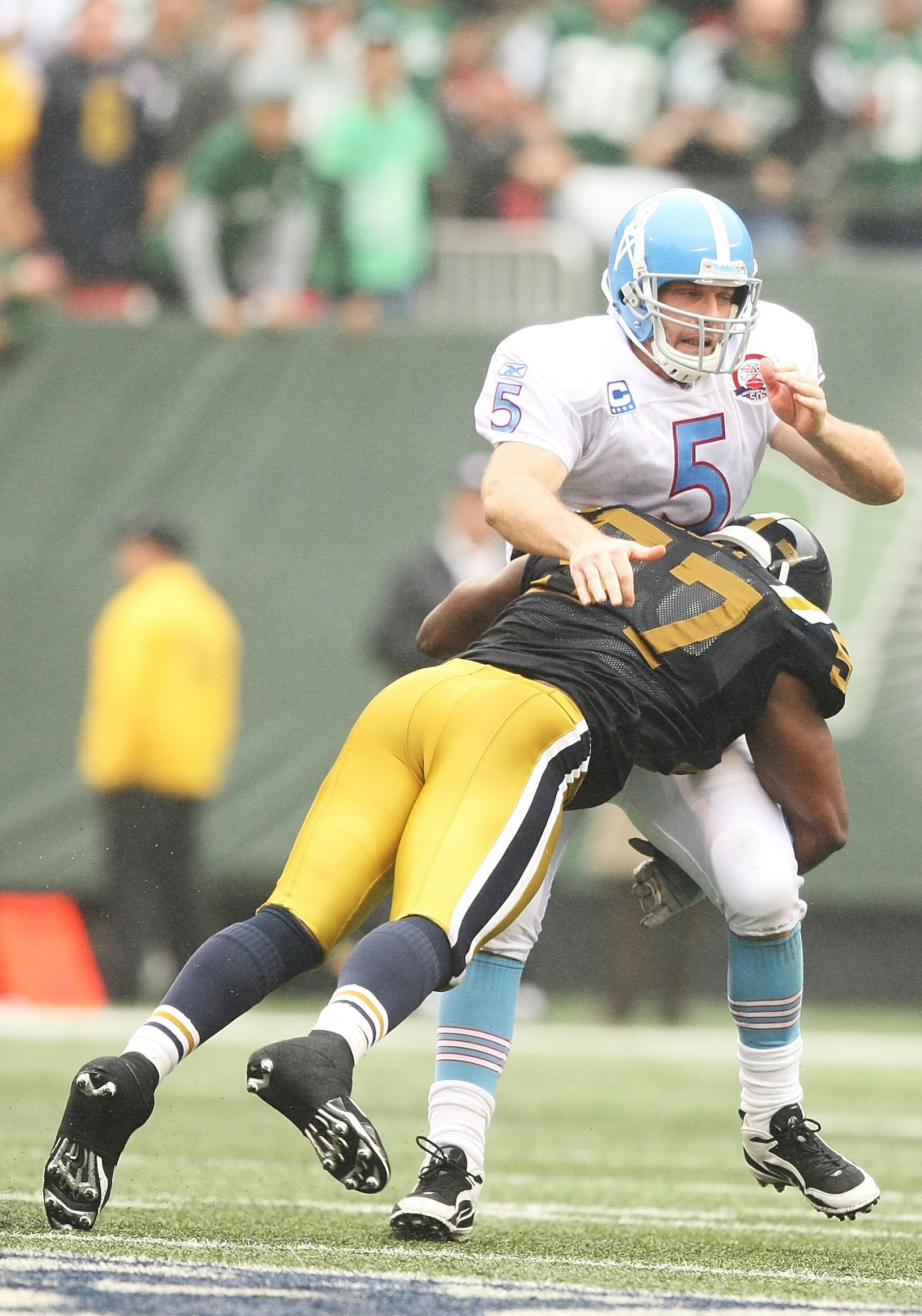 EAST RUTHERFORD, NJ - SEPTEMBER 27:  Bart Scott #57 of The New York Jets hits Kerry Collins #5 of The Tennessee Titans as he passes during their game on September 27, 2009 at Giants Stadium in East Rutherford, New Jersey.  (Photo by Al Bello/Getty Images)