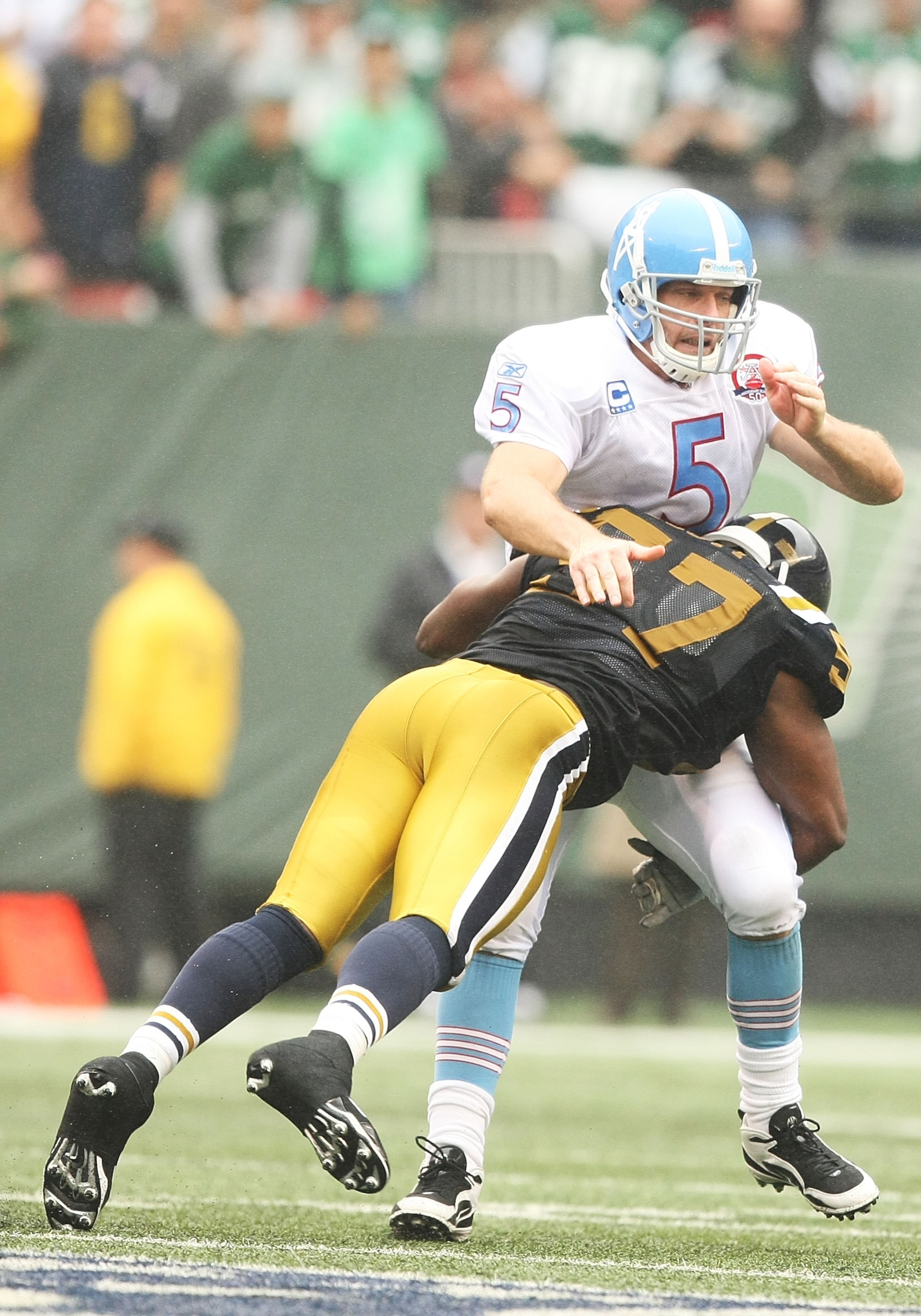 EAST RUTHERFORD, NJ - SEPTEMBER 27:  Bart Scott #57 of The New York Jets hits Kerry Collins #5 of The Tennessee Titans as he passes during their game on September 27, 2009 at Giants Stadium in East Rutherford, New Jersey.  (Photo by Al Bello/Getty Images)