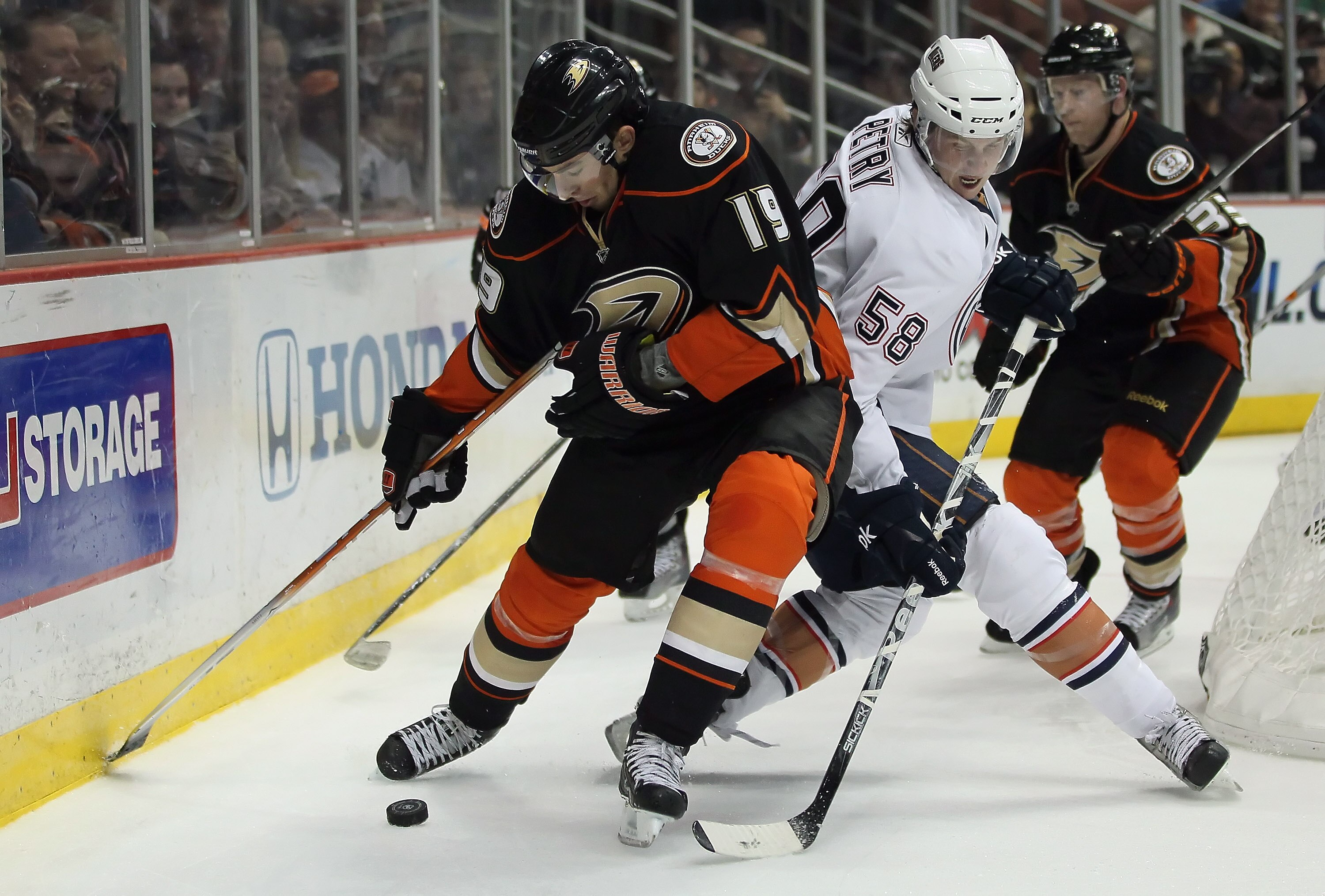 ANAHEIM, CA - JANUARY 16:  Joffrey Lupul #19 of the Anaheim Ducks and Jeff Petry #58 of the Edmonton Oilers battle for the puck in the third period at the Honda Center on January 16, 2011 in Anaheim, California. The Ducks defeated the Oilers 3-2.  (Photo