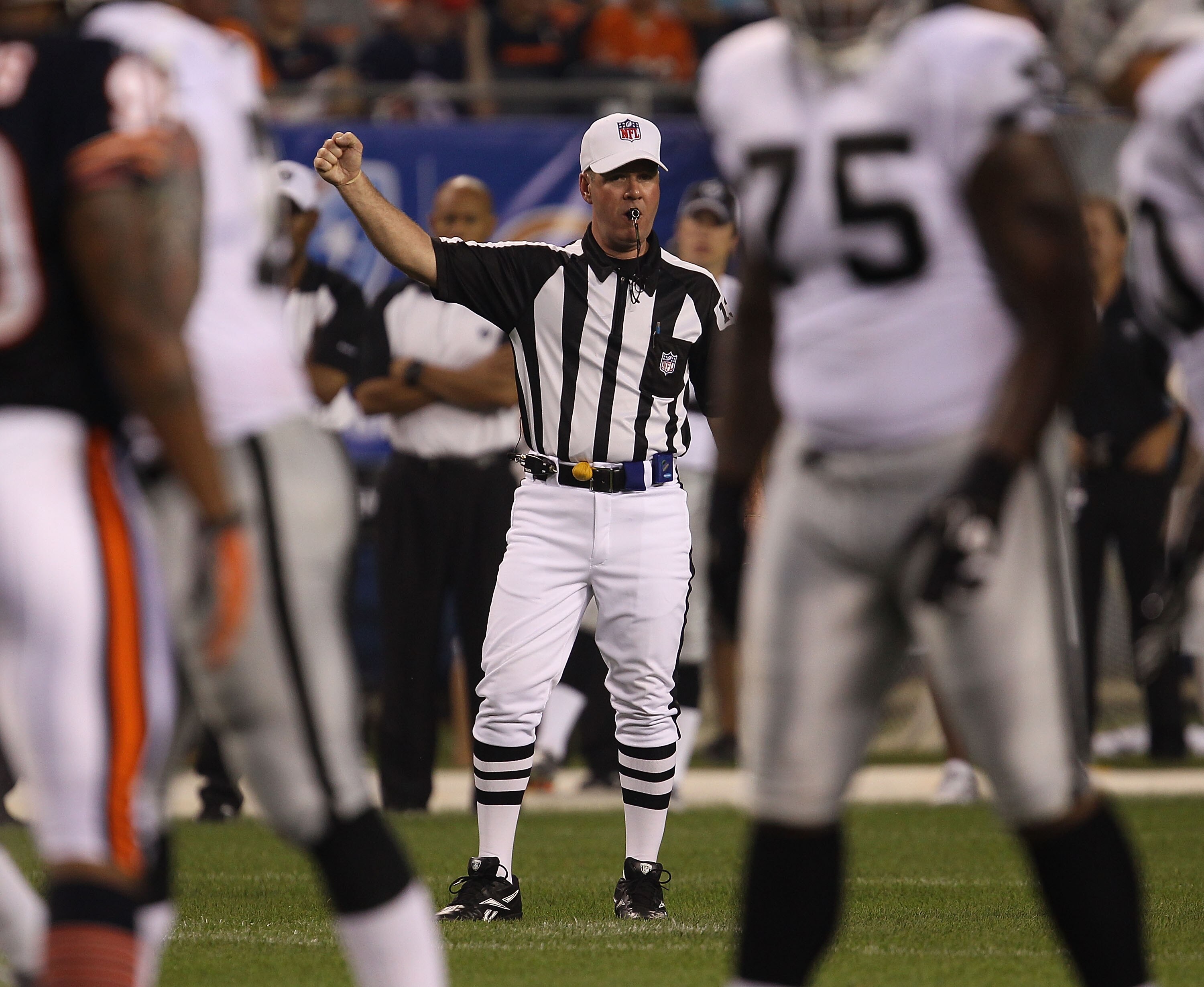 CHICAGO - AUGUST 21: Referee John Parry #132 signals for play to begin between the Chicago Bears and the Oakland Raiders during a preseason game at Soldier Field on August 21, 2010 in Chicago, Illinois. The Raiders defeated the Bears 32-17. (Photo by Jona
