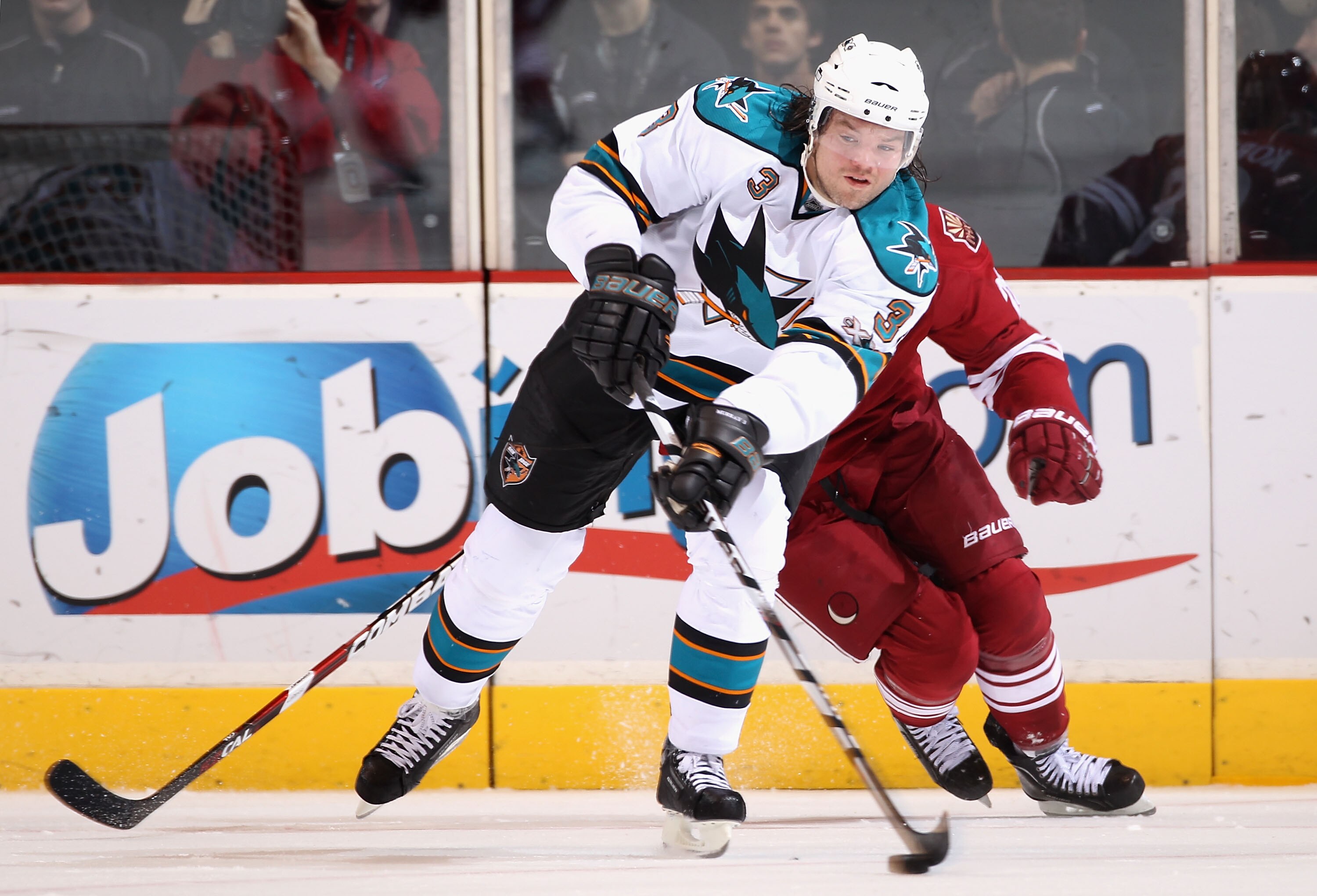 GLENDALE, AZ - JANUARY 17:  Douglas Murray #3 of the San Jose Sharks passes the puck during the NHL game against the Phoenix Coyotes at Jobing.com Arena on January 17, 2011 in Glendale, Arizona.  The Sharks defeated the Coyotes 4-2.  (Photo by Christian P