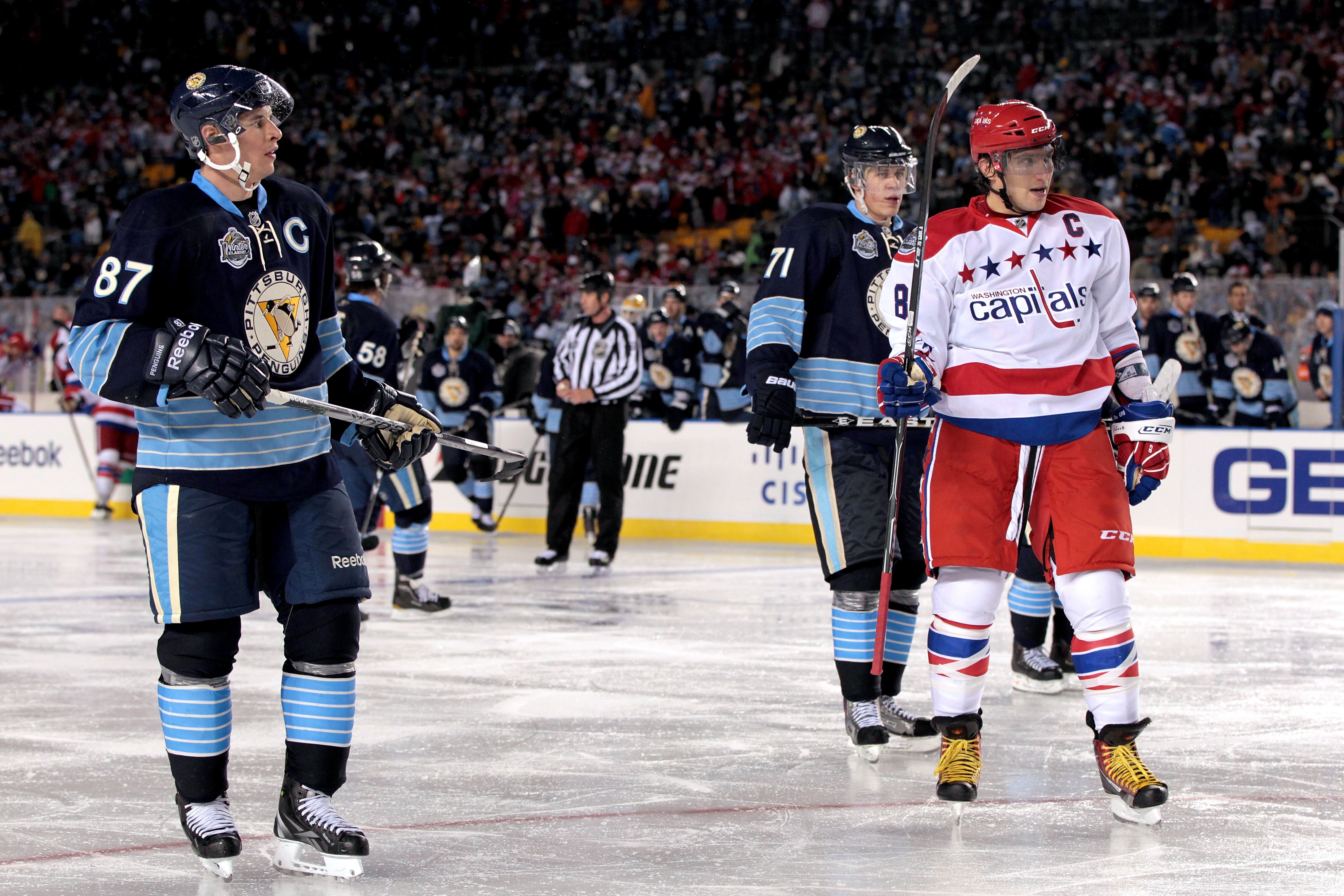 PITTSBURGH, PA - JANUARY 01:  Alex Ovechkin #8 of the Washington Capitals looks on alongside Sidney Crosby #81and Evgeni Malkin #71 of the Pittsburgh Penguins during the 2011 NHL Bridgestone Winter Classic at Heinz Field on January 1, 2011 in Pittsburgh,