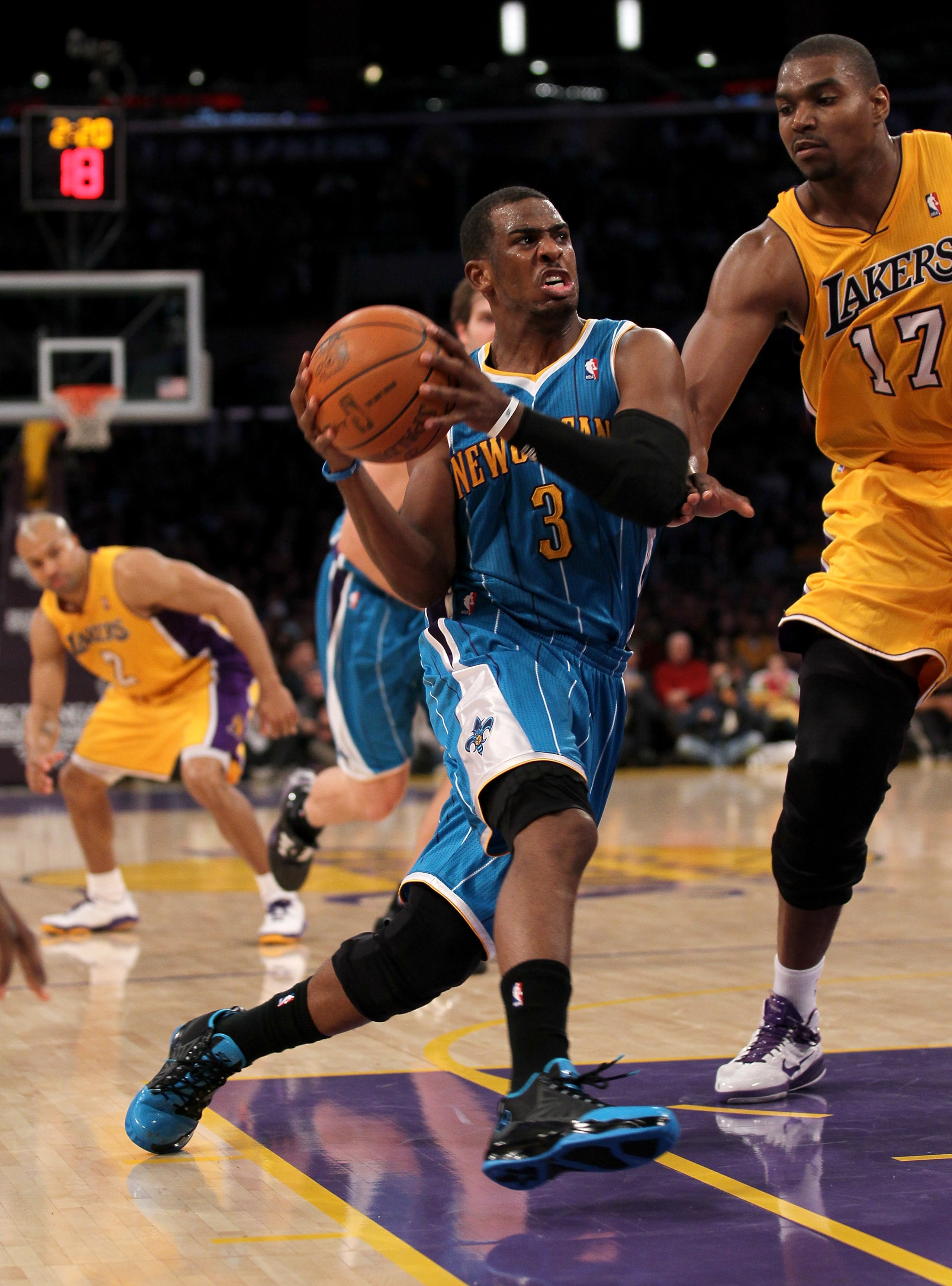 LOS ANGELES, CA - JANUARY 7: Chris Paul #3 of the New Orleans Hornets drives against Andrew Bynum #17 of the Los Angeles Lakers at Staples Center on January 7, 2011 in Los Angeles, California. NOTE TO USER: User expressly acknowledges and agrees that, b LOS ANGELES, CA - JANUARY 7: Chris Paul #3 of the New Orleans Hornets drives against Andrew Bynum #17 of the Los Angeles Lakers at Staples Center on January 7, 2011 in Los Angeles, California. NOTE TO USER: User expressly acknowledges and agrees that, b