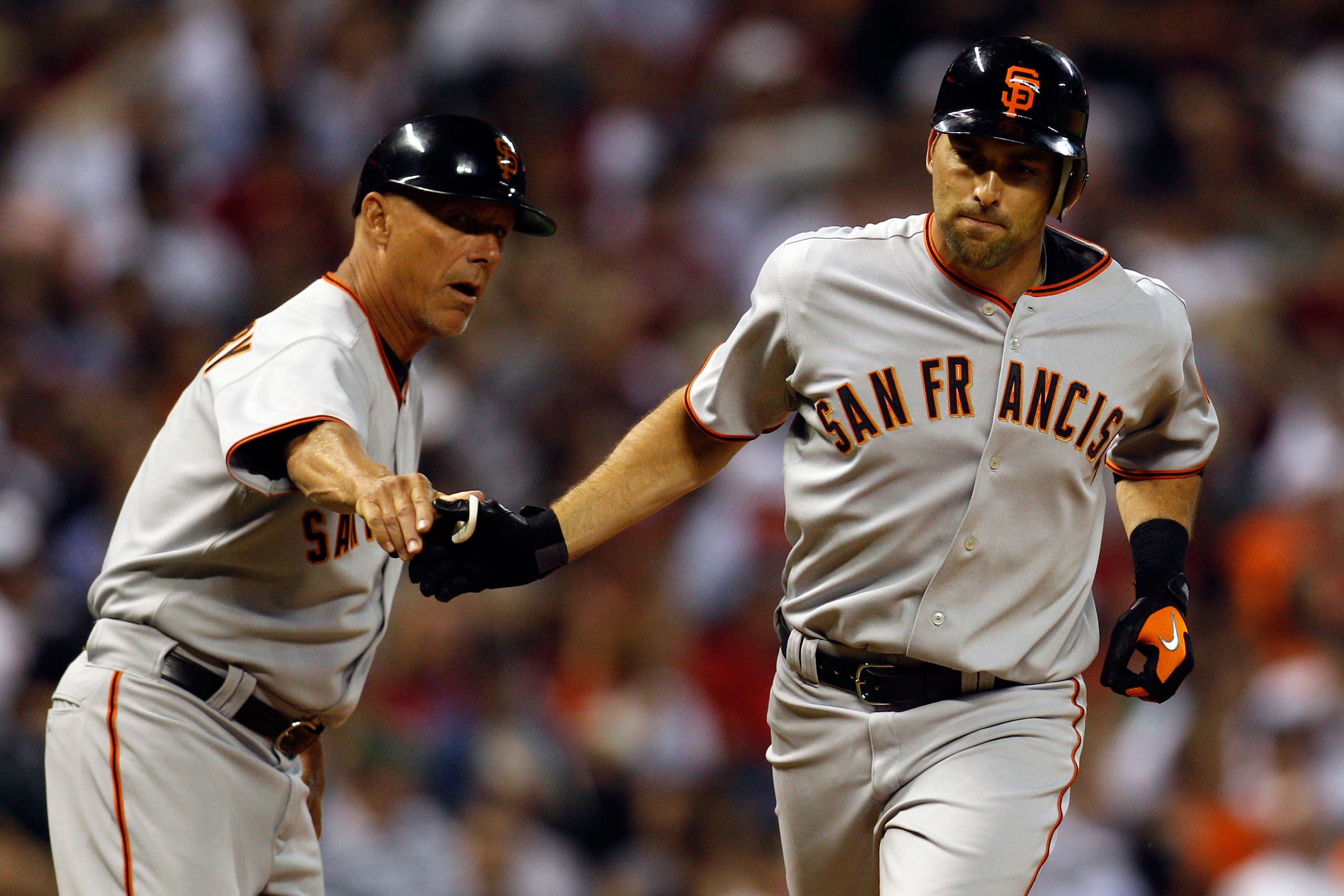 HOUSTON - APRIL 05:  Mark DeRosa #7 of the San Francisco Giants rounds third base after hitting a home run against the Houston Astros on Opening Day at Minute Maid Park on April 5, 2010 in Houston, Texas.   The Giants defeated the Astros 5-2.  (Photo by C