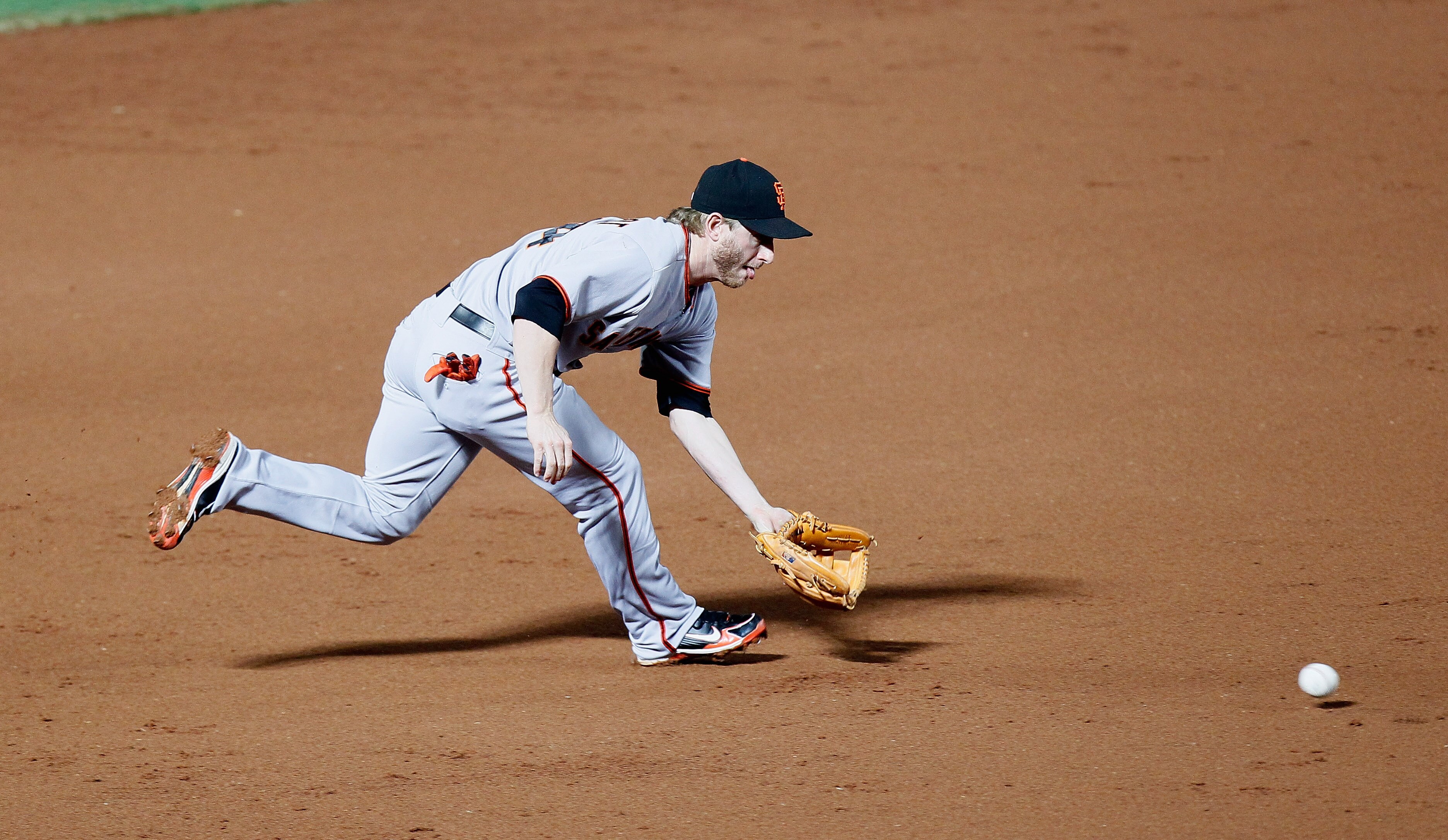 ATLANTA - OCTOBER 11:  Mike Fontenot #14 of the San Francisco Giants against the Atlanta Braves during Game Four of the NLDS of the 2010 MLB Playoffs at Turner Field on October 11, 2010 in Atlanta, Georgia.  (Photo by Kevin C. Cox/Getty Images)