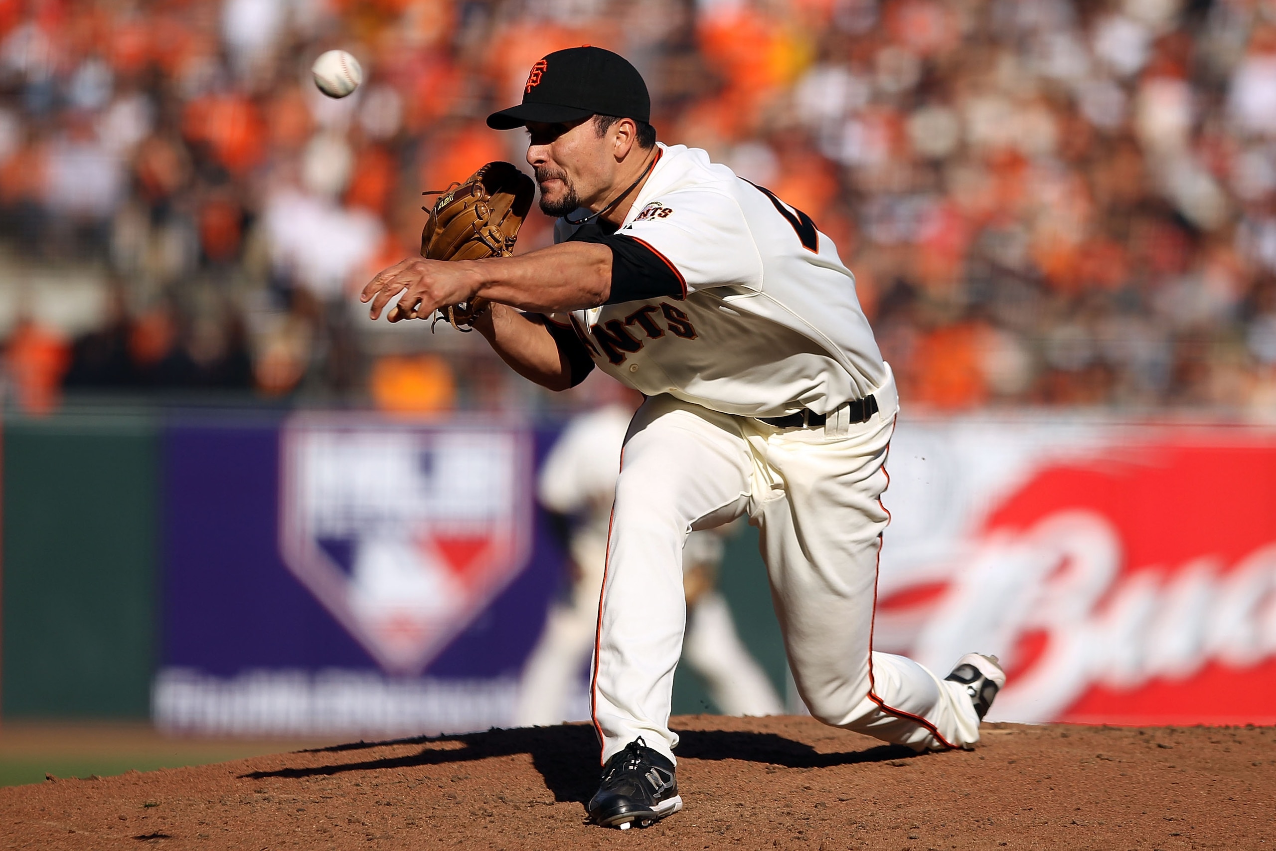 SAN FRANCISCO - OCTOBER 19:  Javier Lopez #49 of the San Francisco Giants throws a pitch in the eighth inning against the Philadelphia Phillies in Game Three of the NLCS during the 2010 MLB Playoffs at AT&T Park on October 19, 2010 in San Francisco, Calif