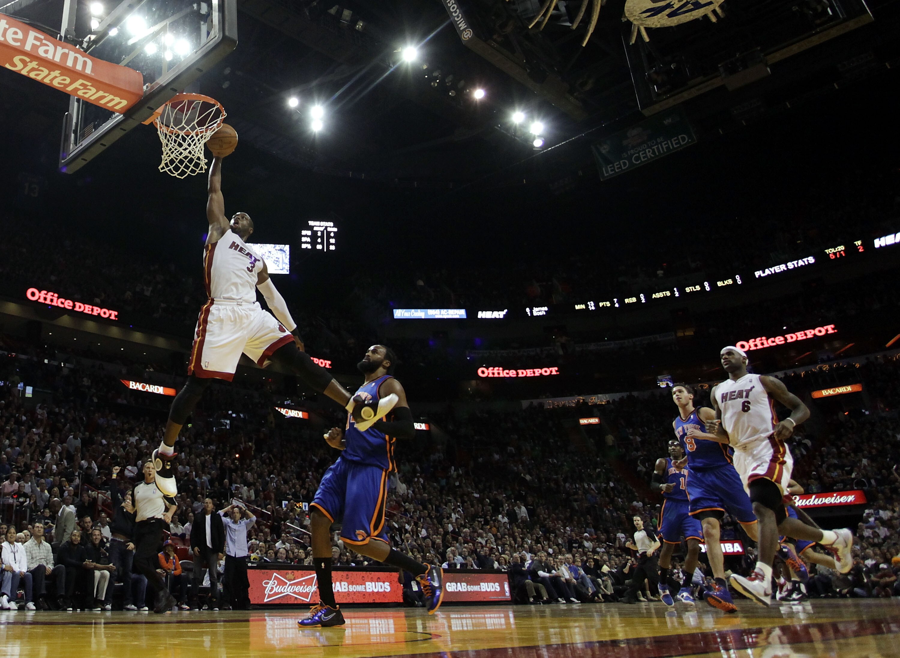 MIAMI - DECEMBER 28:  Guard Dwyane Wade #3 of the Miami Heat dunks against the New York Knicks at American Airlines Arena on December 28, 2010 in Miami, Florida.  (Photo by Marc Serota/Getty Images)