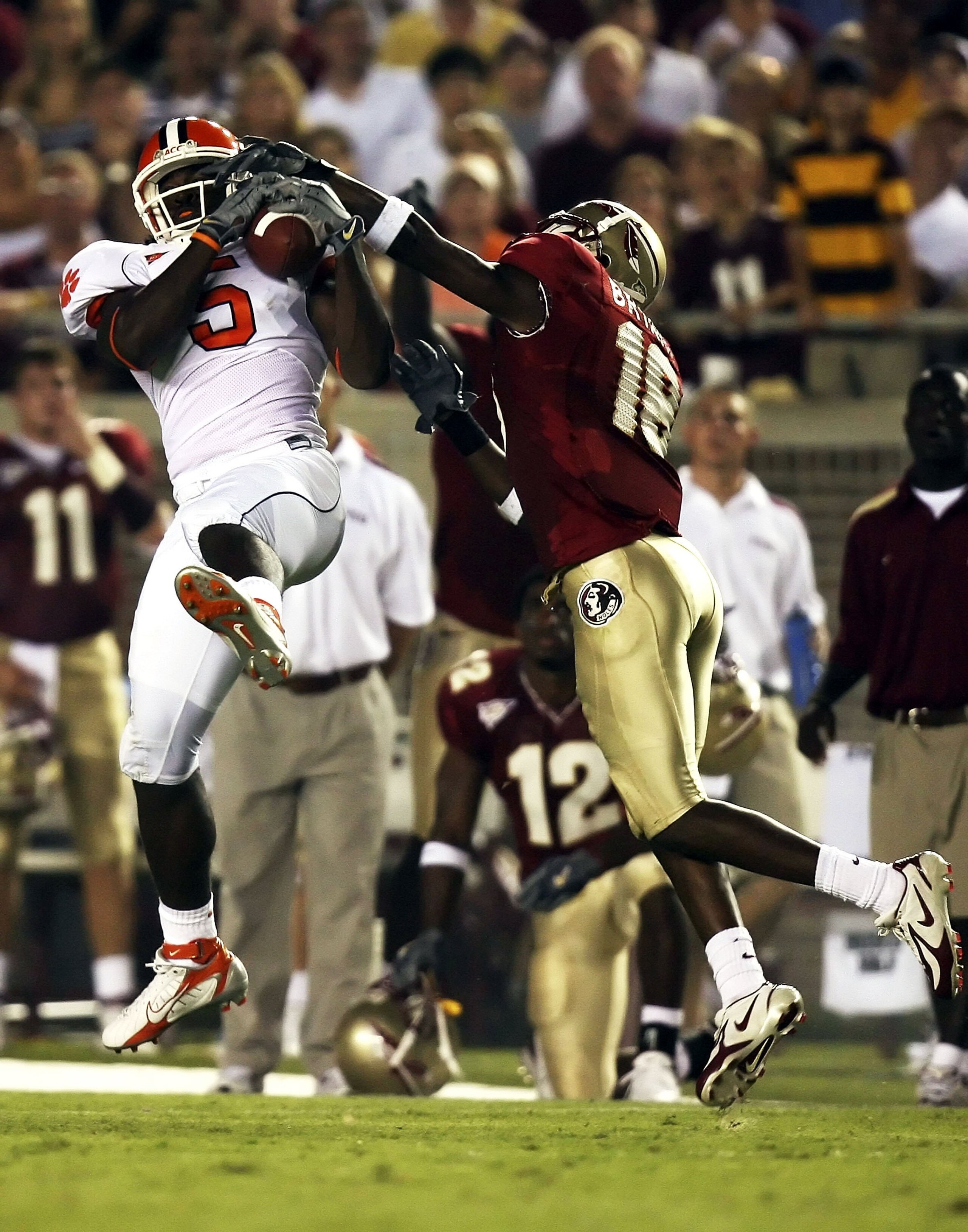 TALLAHASSEE, FL - SEPTEMBER 16:  Cornerback J.R. Bryant #18 of the Florida State Seminoles can't stop a reception by wide receiver Rendrick Taylor #5 of the Clemson Tigers at Doak Campbell Stadium on September 16, 2006 in Tallahassee, Florida.  (Photo by 